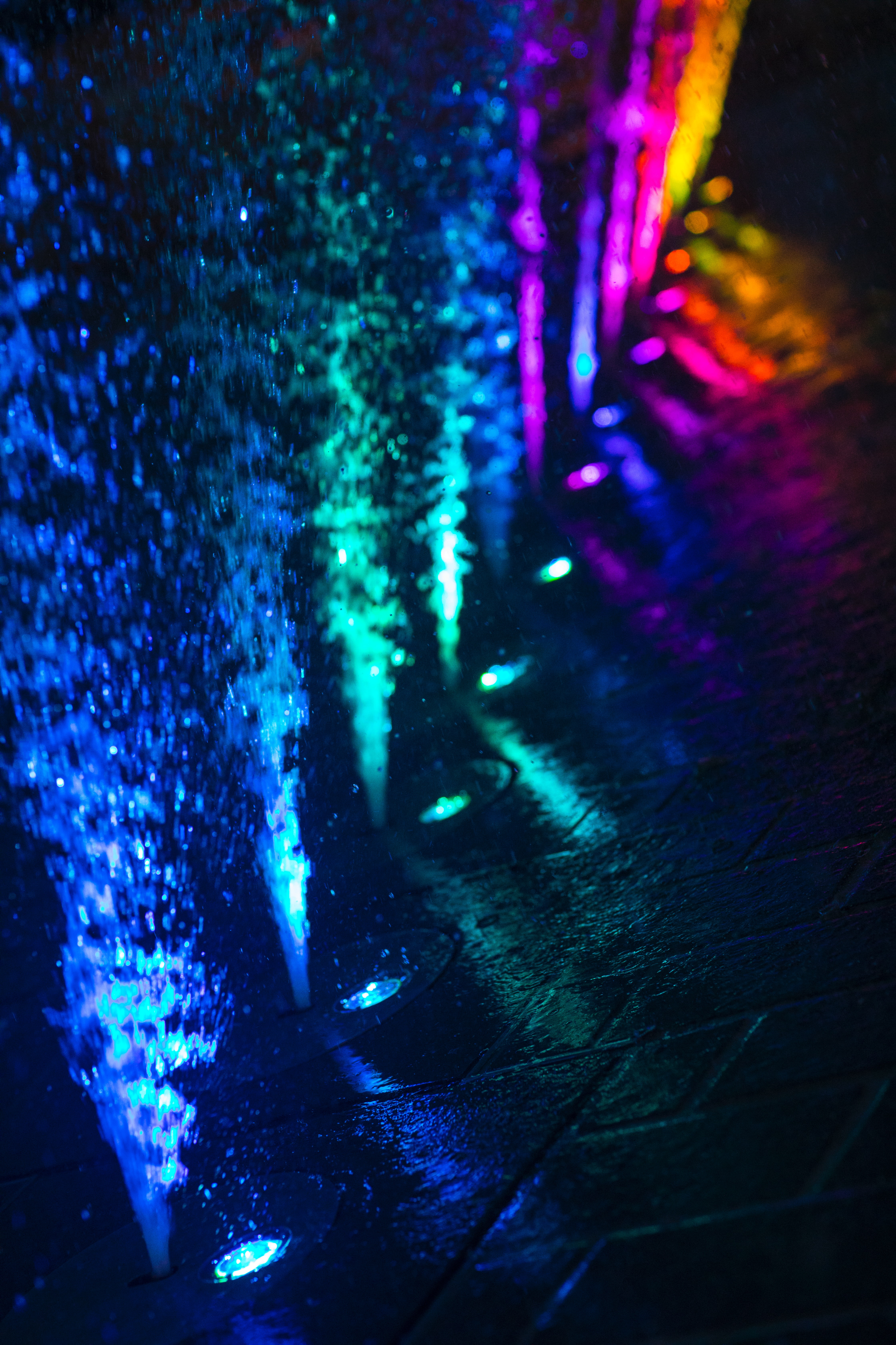 spray, water, fountain, miscellanea, miscellaneous, multicolored, motley, backlight, illumination Panoramic Wallpaper