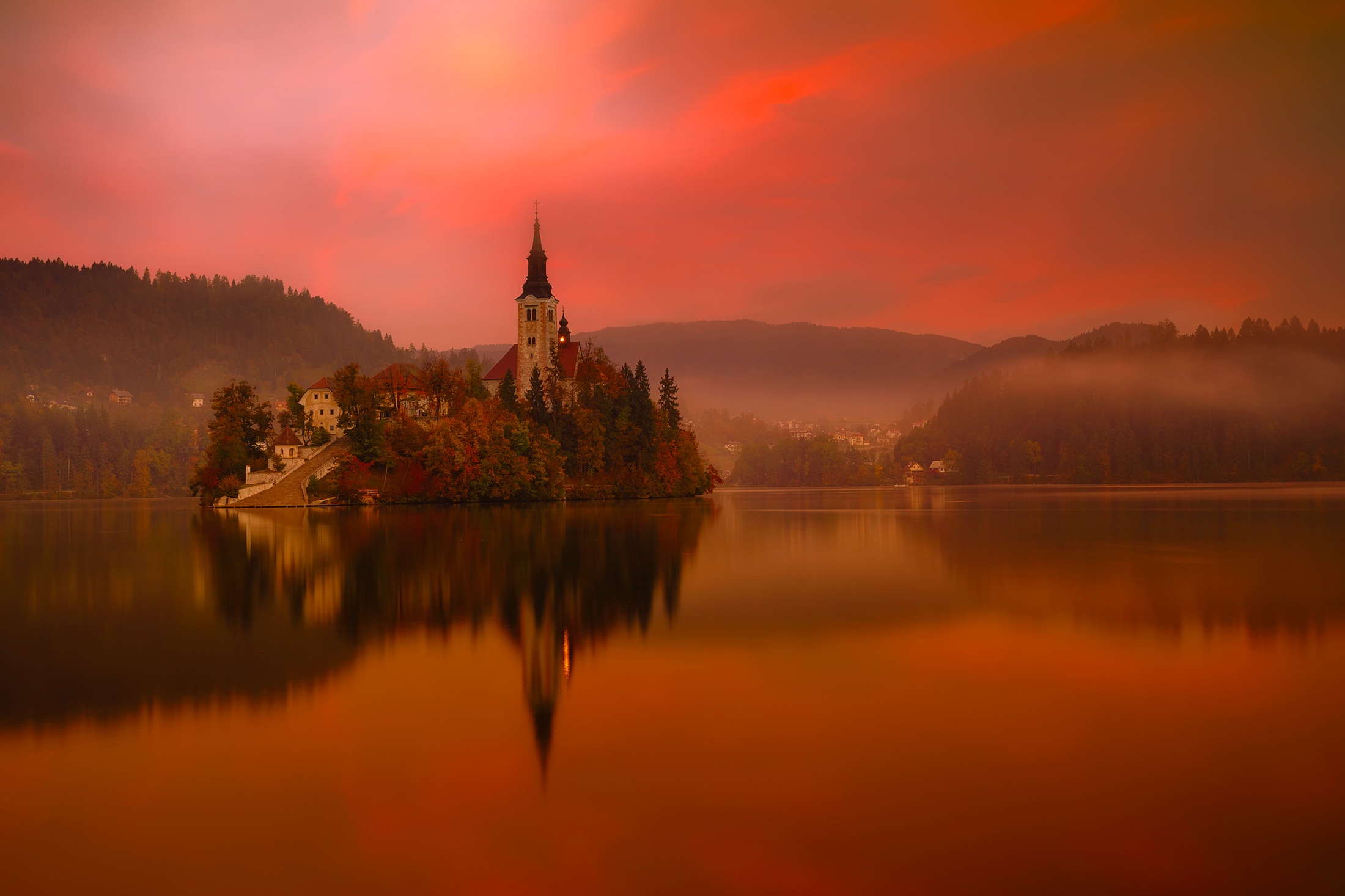 Download mobile wallpaper Reflection, Slovenia, Churches, Lake Bled, Religious, Orange (Color), Assumption Of Mary Church for free.