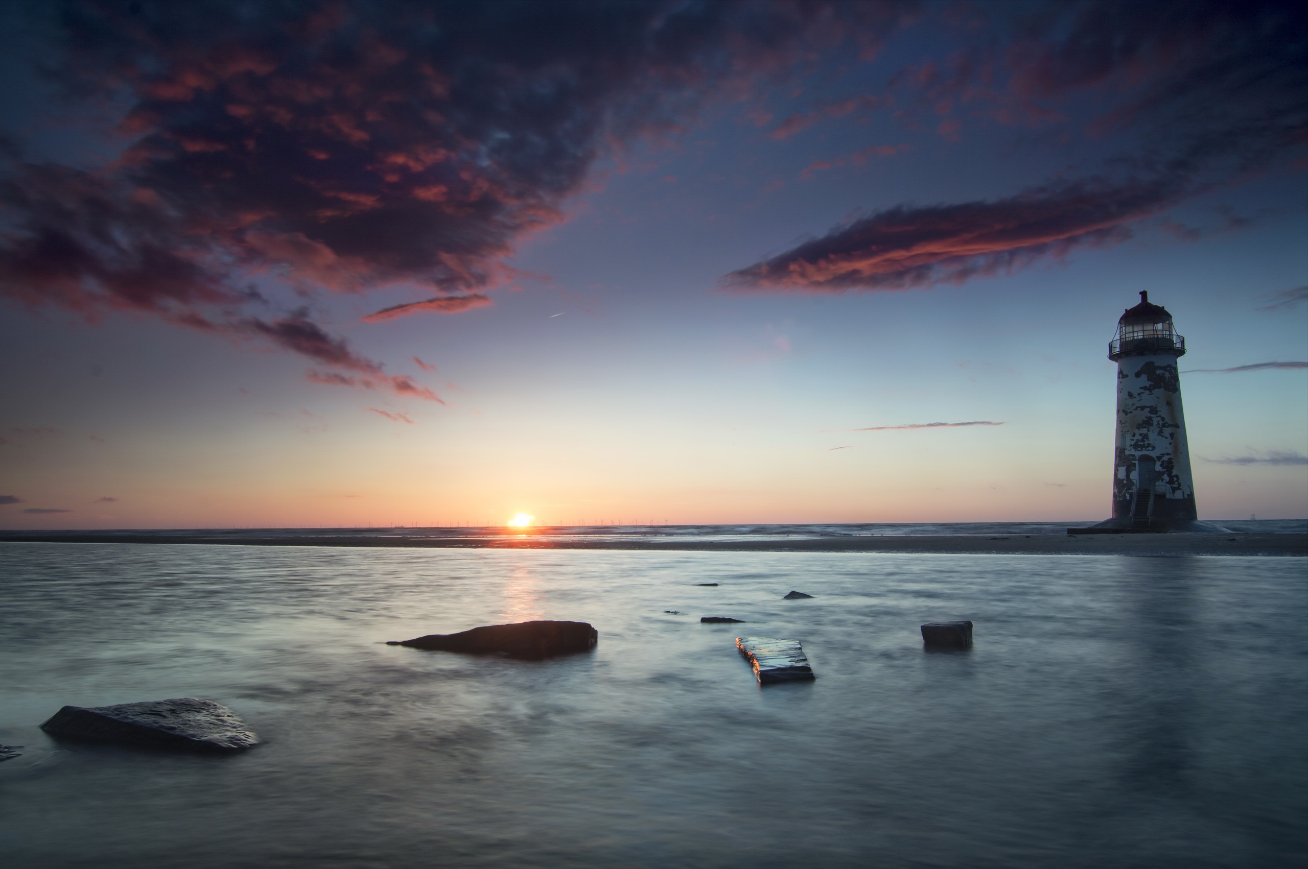 Download mobile wallpaper Sunset, Sea, Horizon, Lighthouse, Man Made for free.