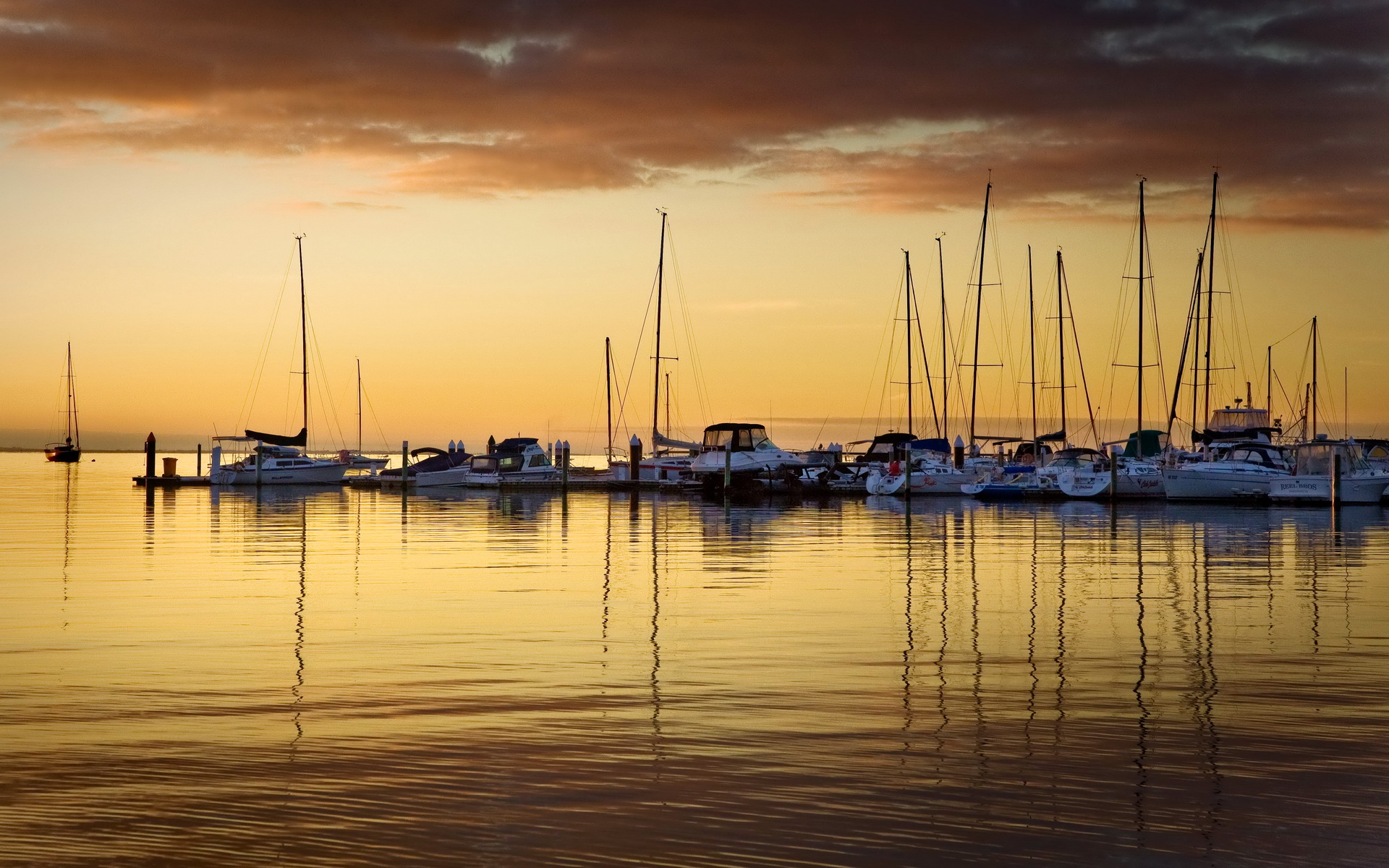 Download mobile wallpaper Sunset, Sky, Ocean, Sunrise, Boat, Cloud, Harbor, Scenic, Man Made for free.