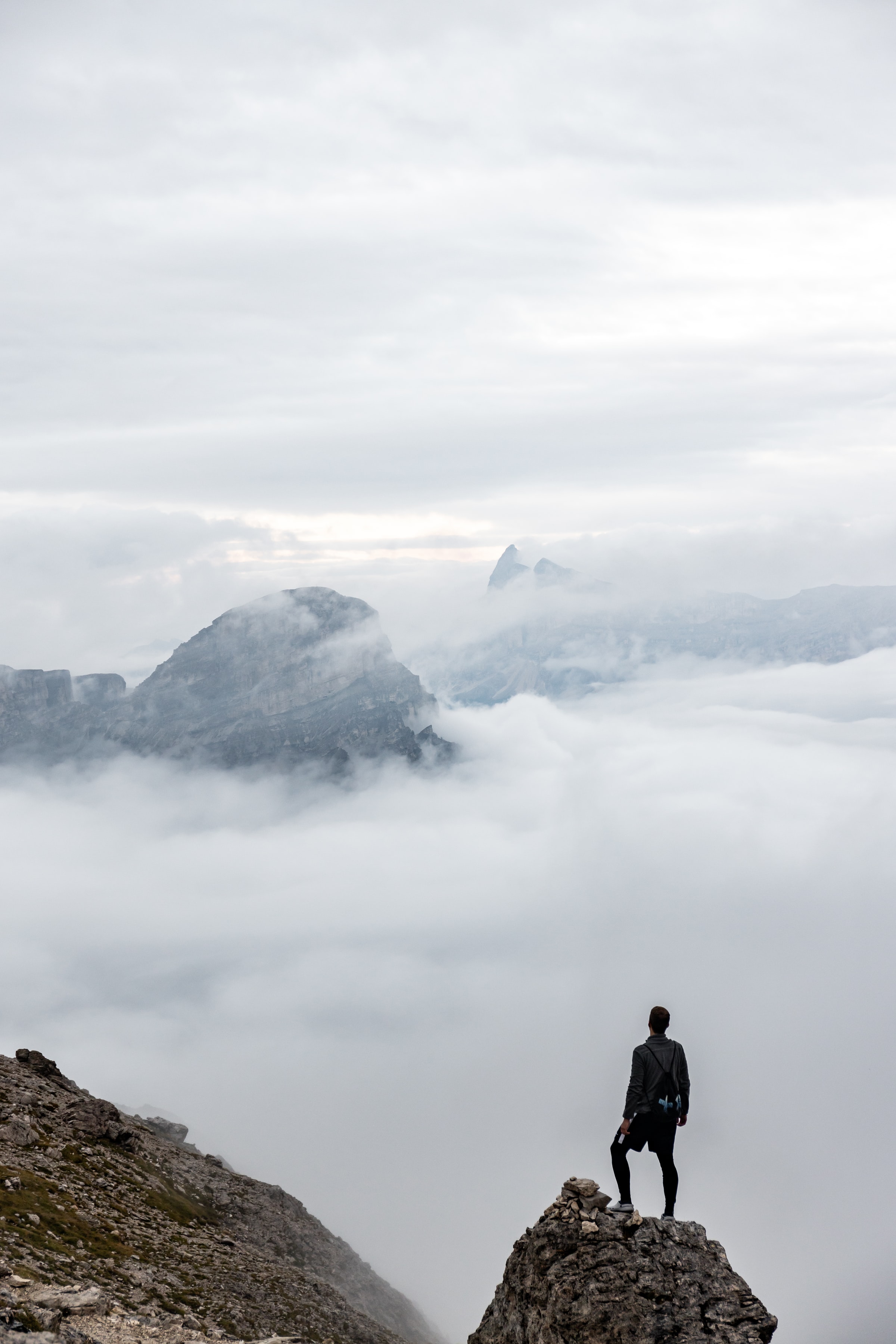 Download mobile wallpaper Traveler, Traveller, Human, Miscellanea, Miscellaneous, Rocks, Fog, Person, Lonely, Loneliness, Alone for free.