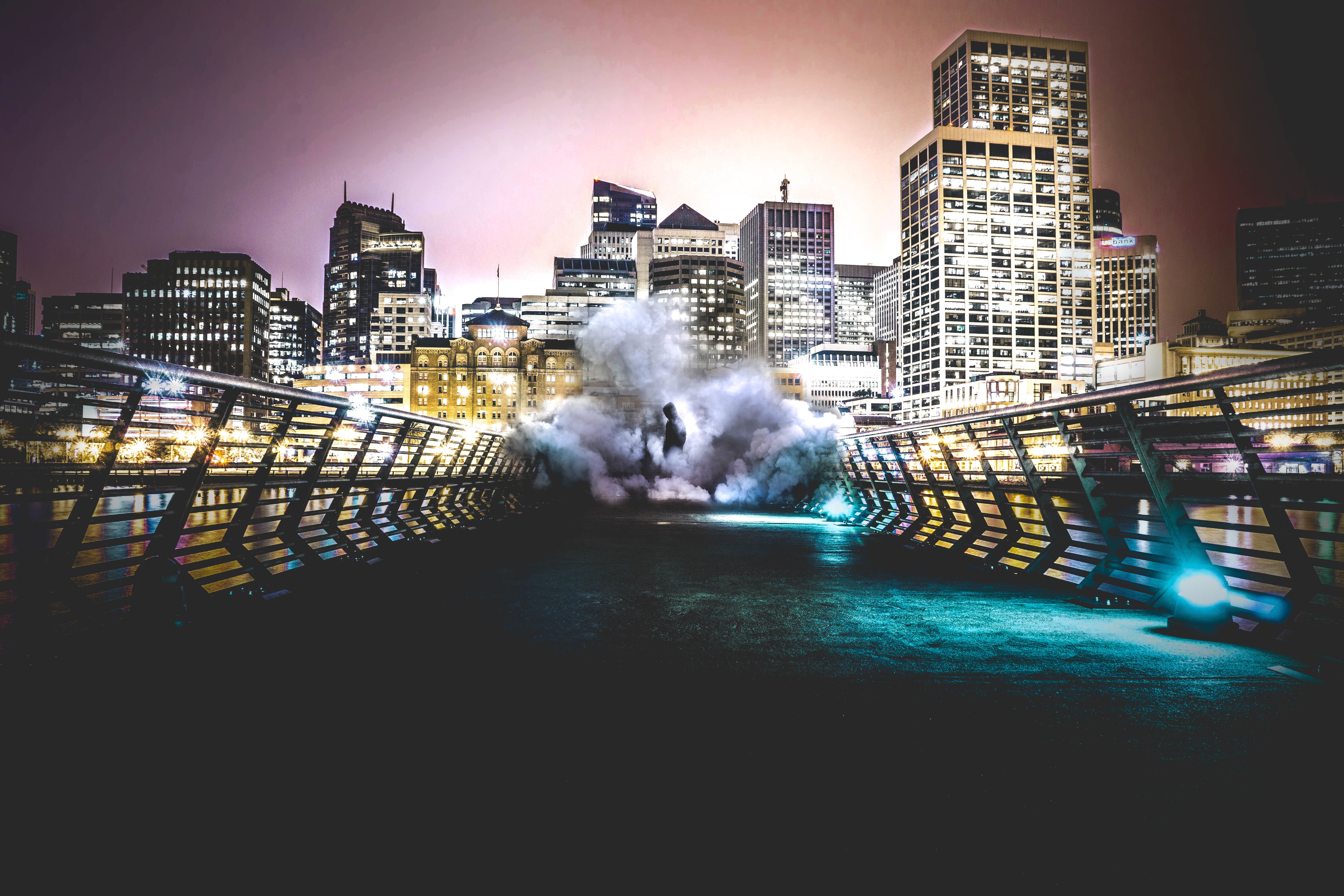 Download mobile wallpaper Building, Cities, Bridge, City, Person, Night, Human, Smoke for free.