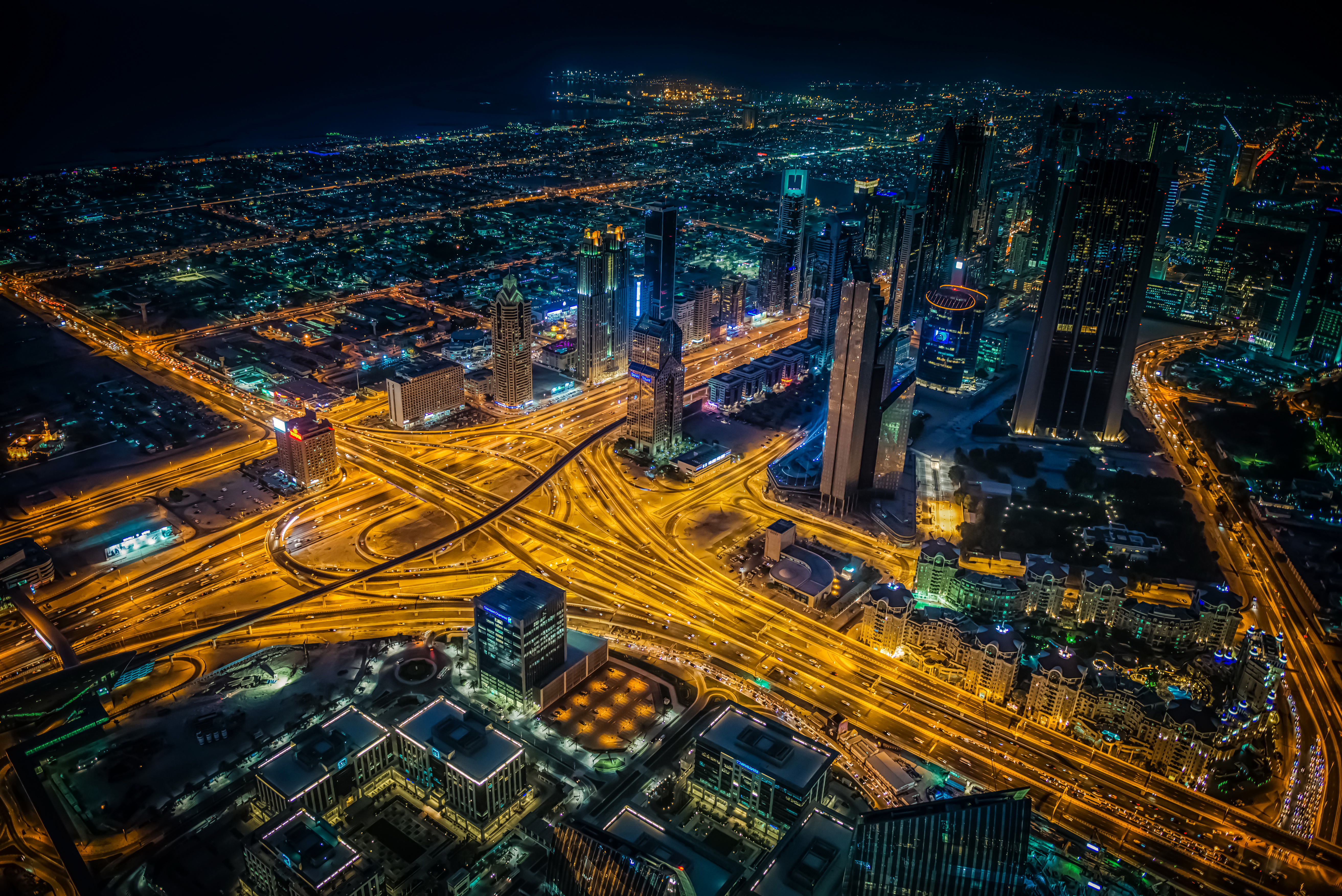 Download mobile wallpaper Cities, Night, City, Skyscraper, Building, Dubai, Highway, Man Made for free.