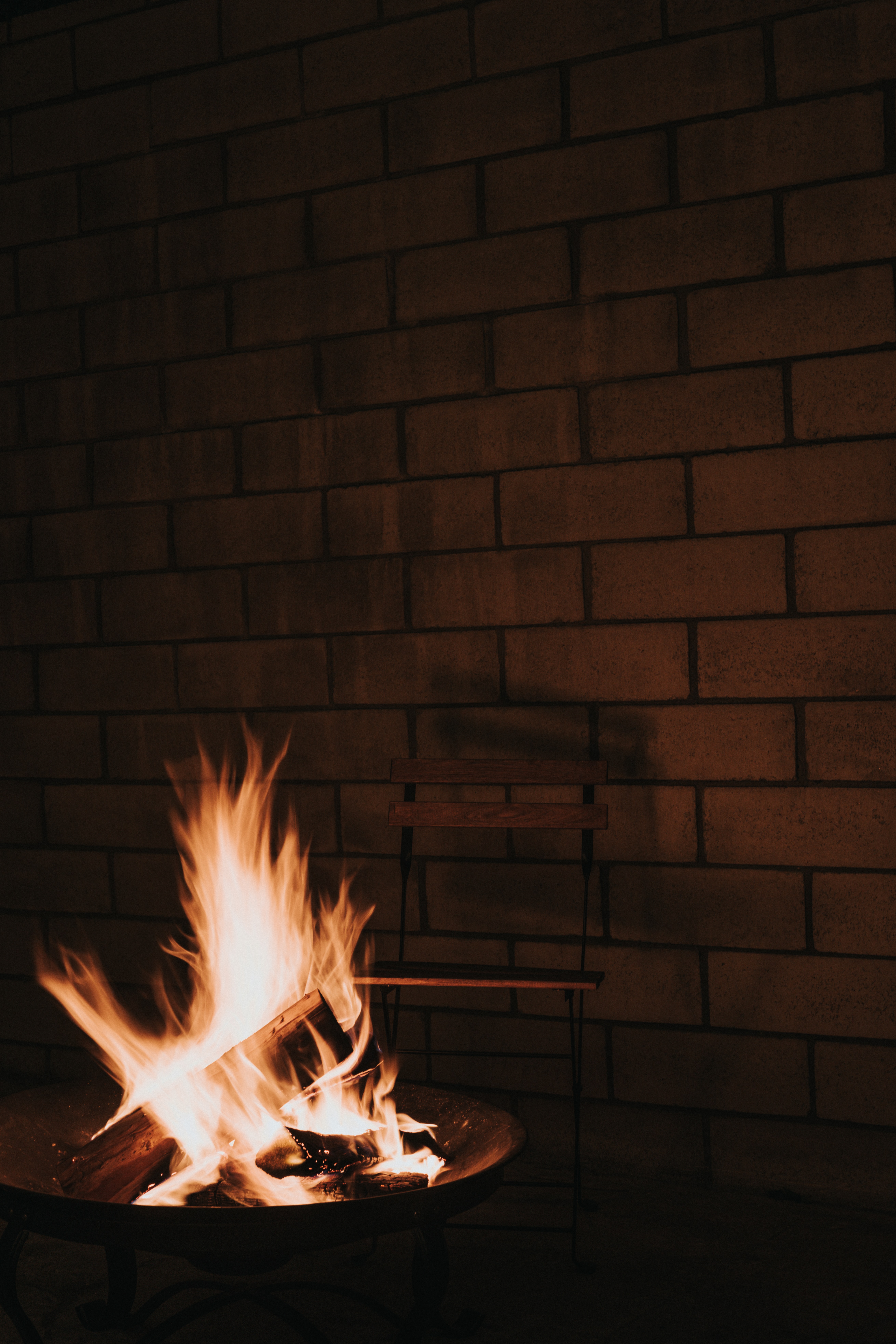 Download mobile wallpaper Chair, Flame, Bonfire, Fire, Firewood, Dark for free.