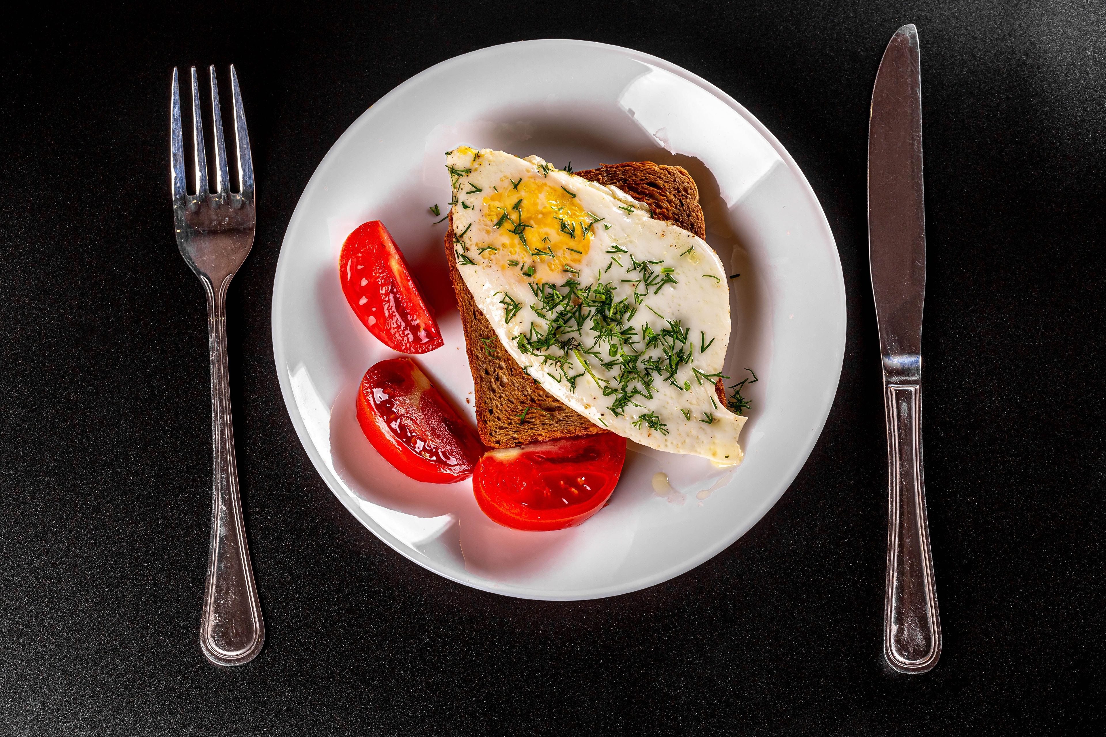 food, egg, bread, fork, fried egg, knife, plate, tomato