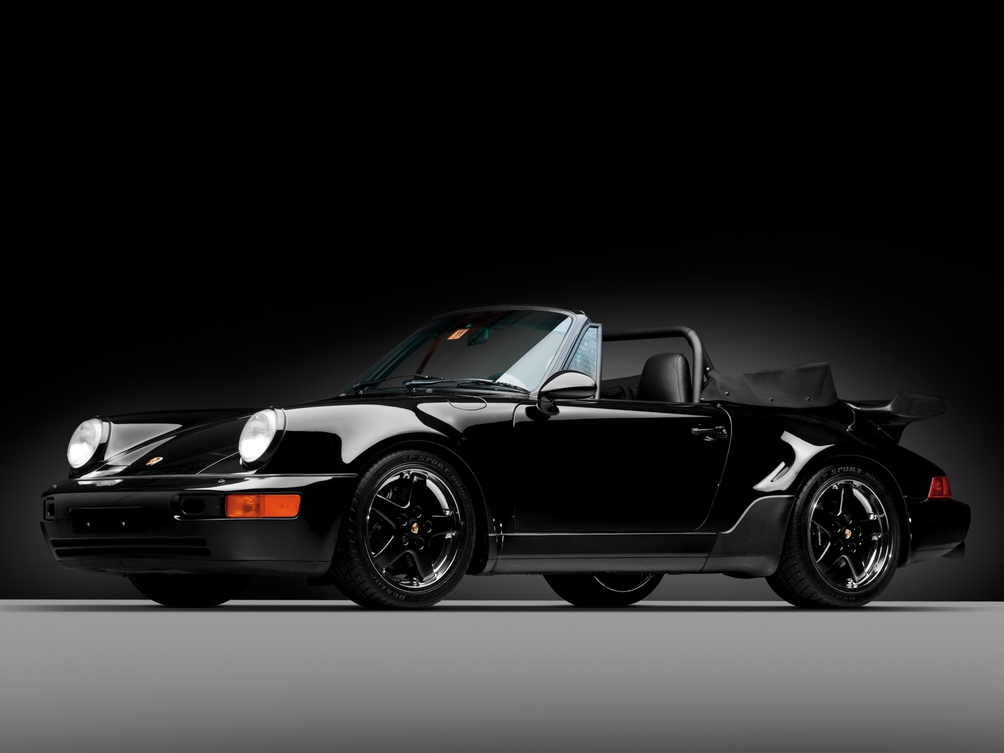 Скачать обои бесплатно America Roadster, 1992, Тачки (Cars), Кабриолет, Porsche 911, Порш (Porsche), Черный картинка на рабочий стол ПК