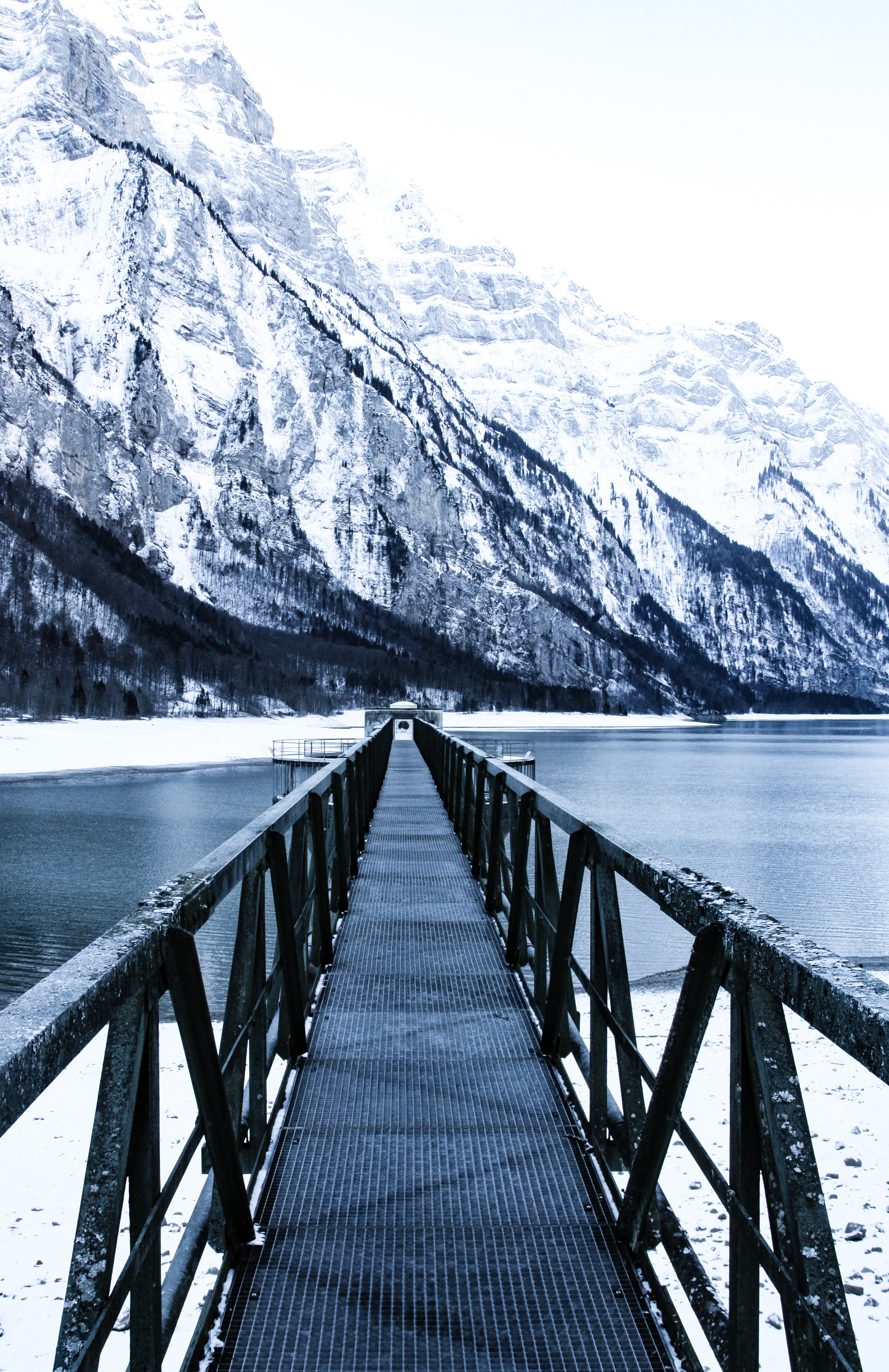Download mobile wallpaper Snow, Lake, Bridge, Nature, Mountains, Pier for free.