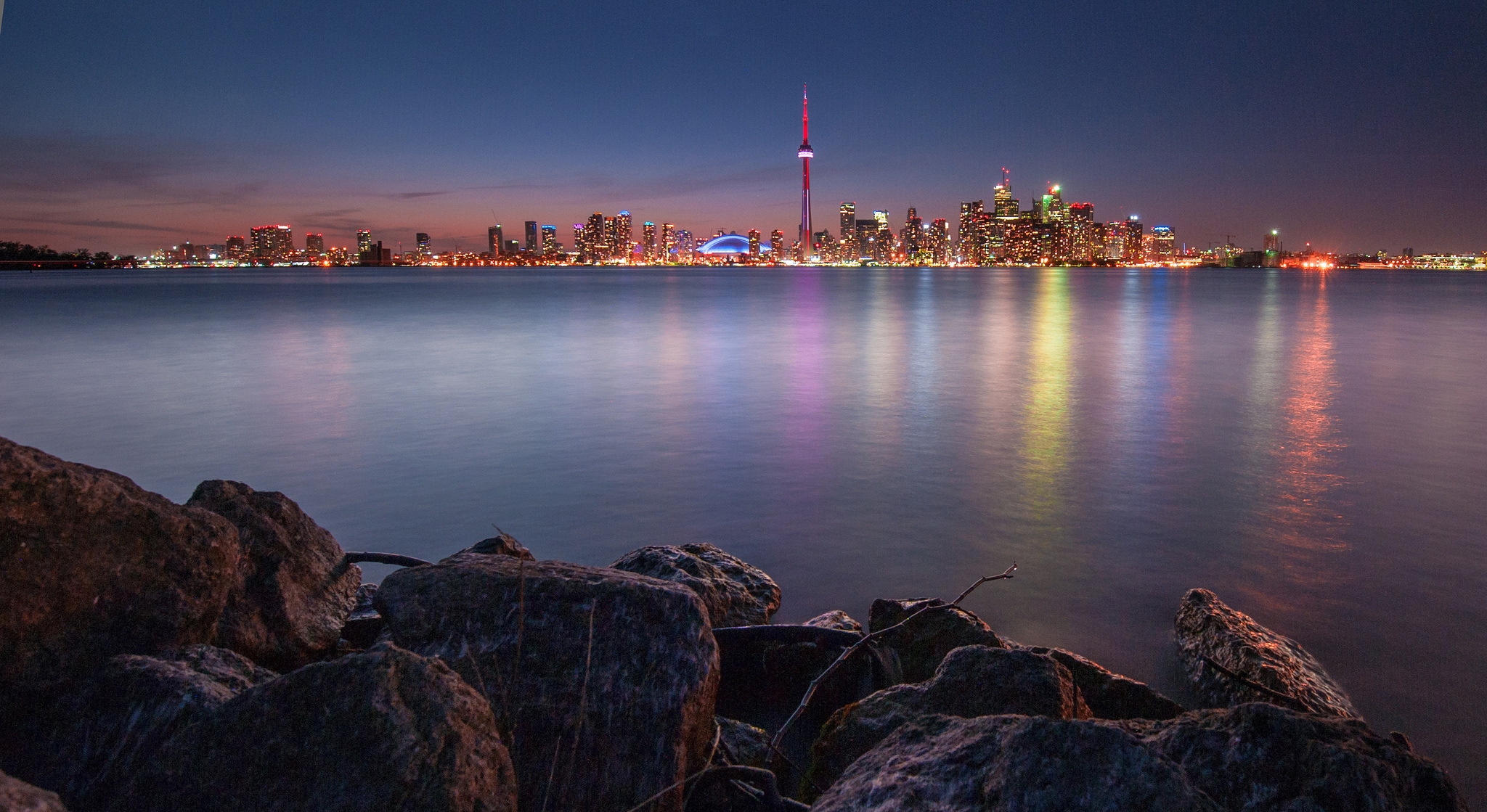 Download mobile wallpaper Toronto, Cities, Reflection, City, Lights, Stones, Lake, Night, Canada for free.