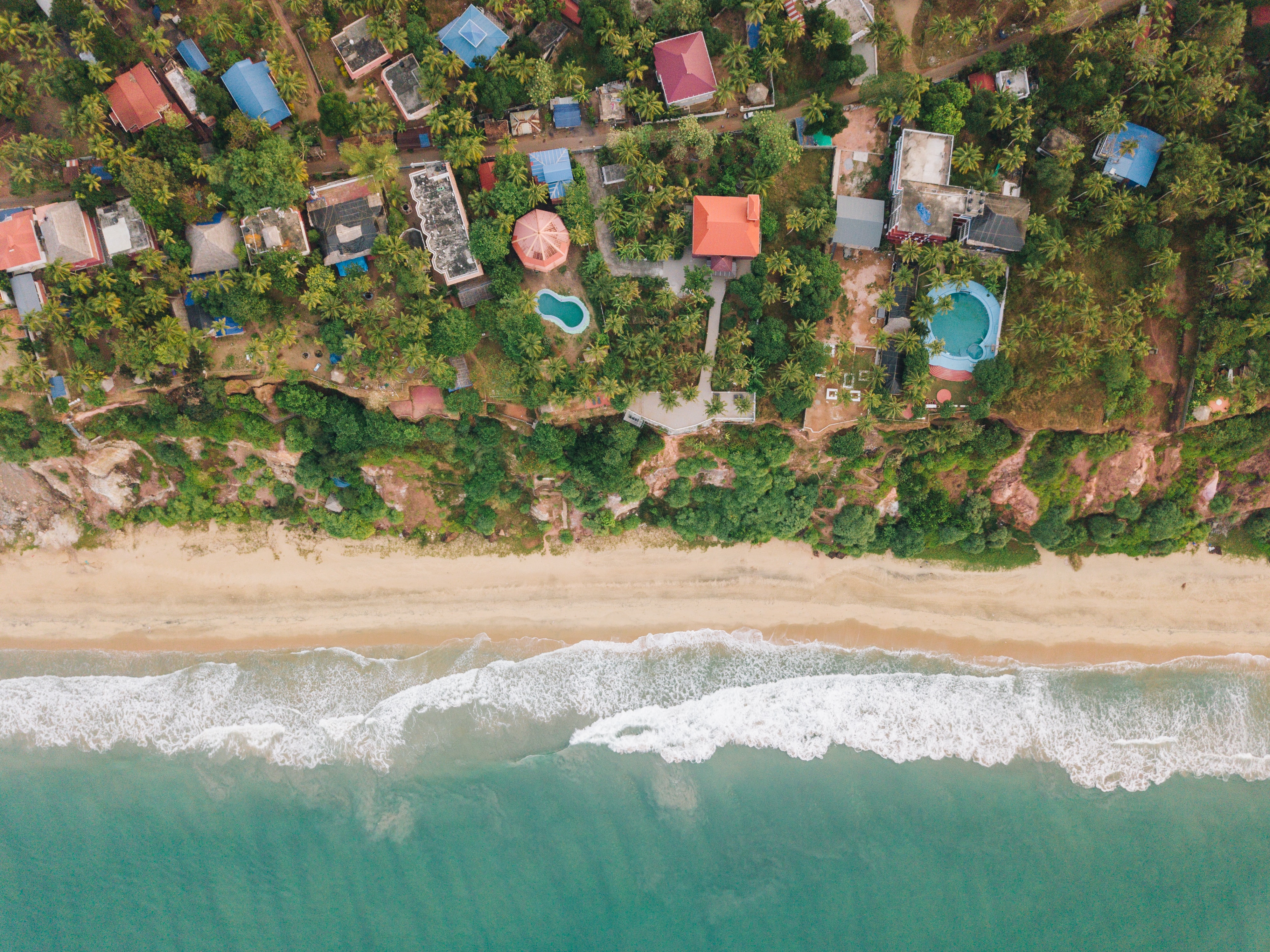 Mobile wallpaper shore, view from above, nature, beach, palms, building, bank