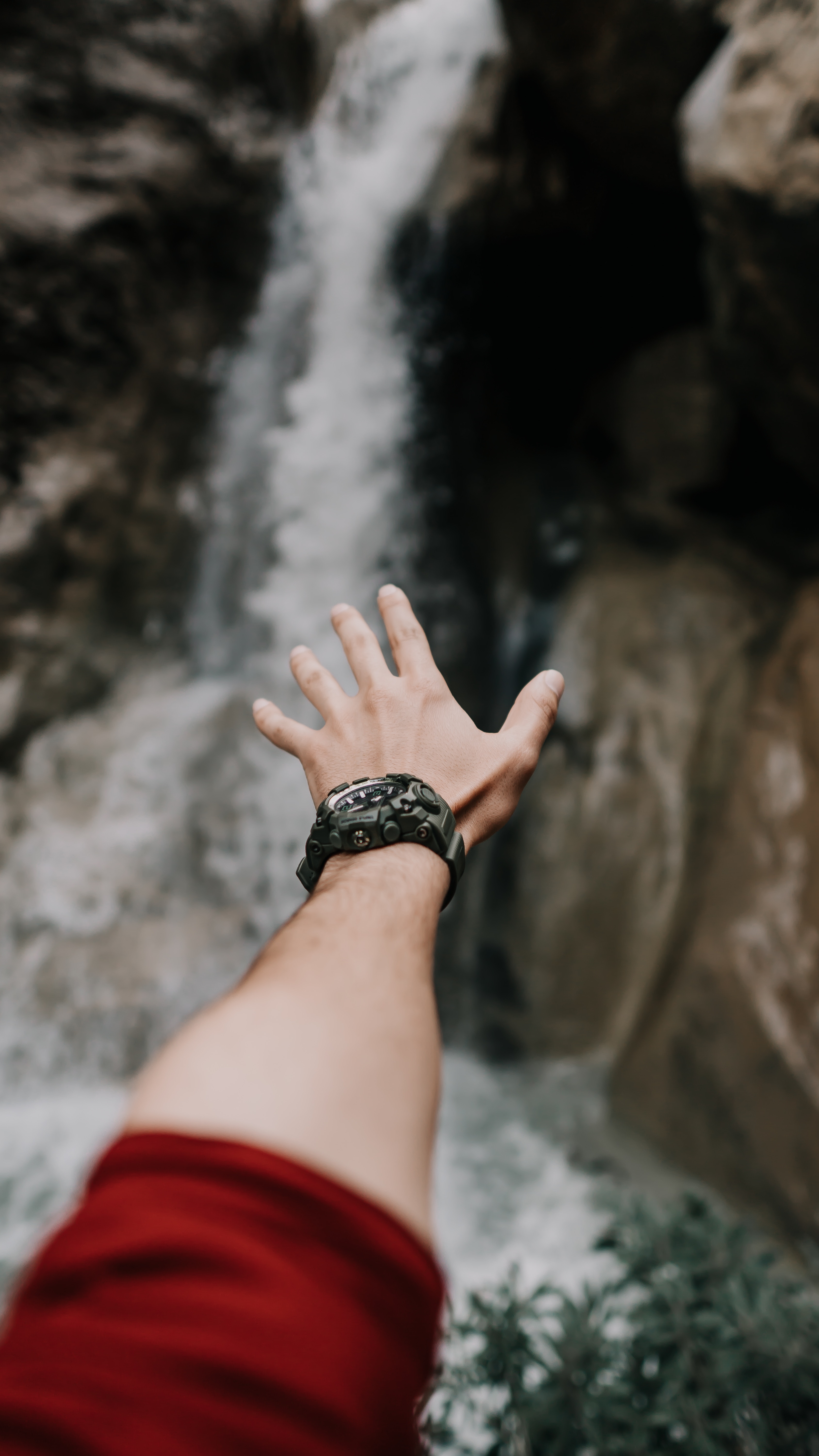 Download mobile wallpaper Miscellanea, Miscellaneous, Waterfall, Hand, Wristwatch, Fingers, Wrist Watch for free.