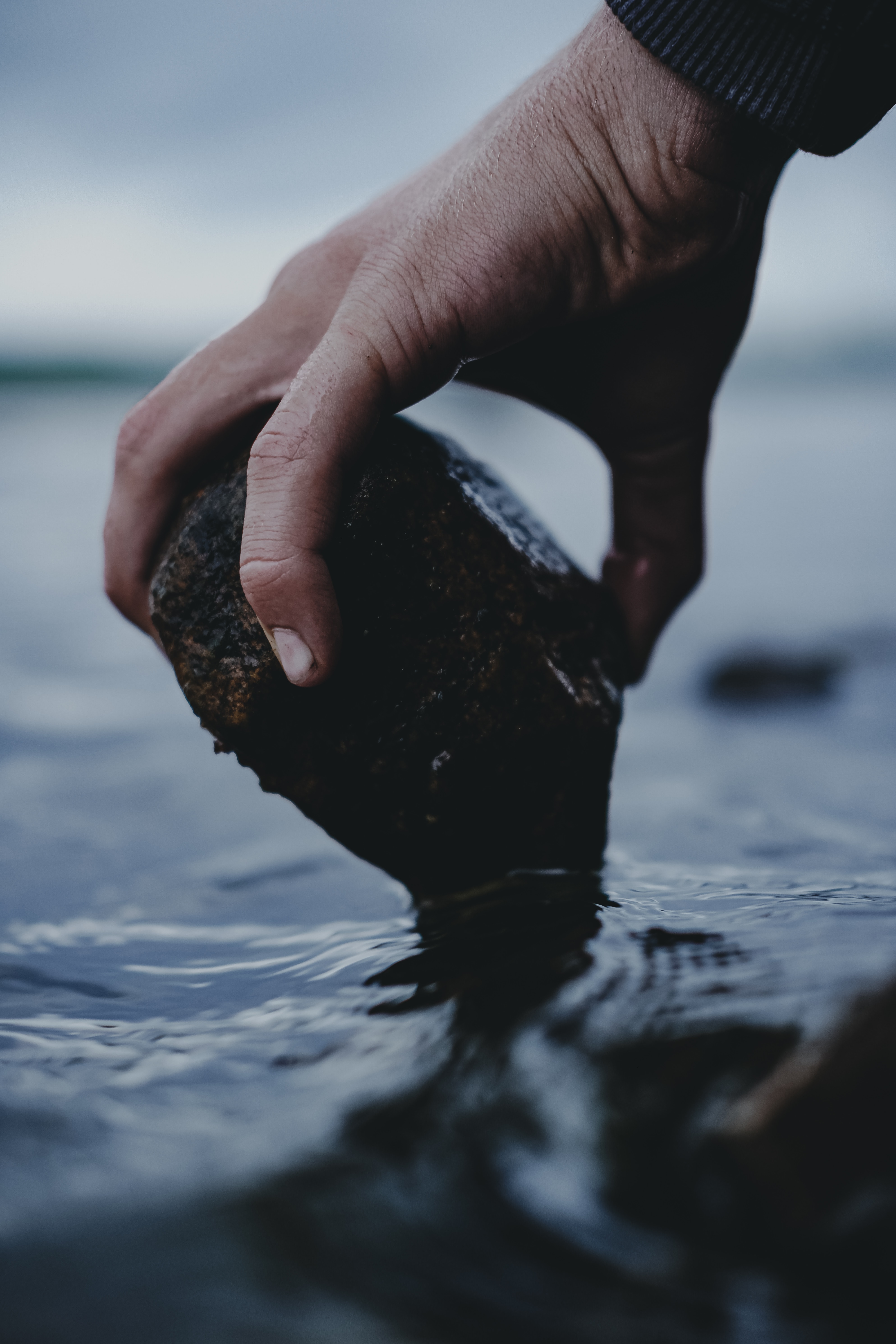 Download mobile wallpaper Rock, Wet, Stone, Water, Hand, Miscellanea, Miscellaneous for free.
