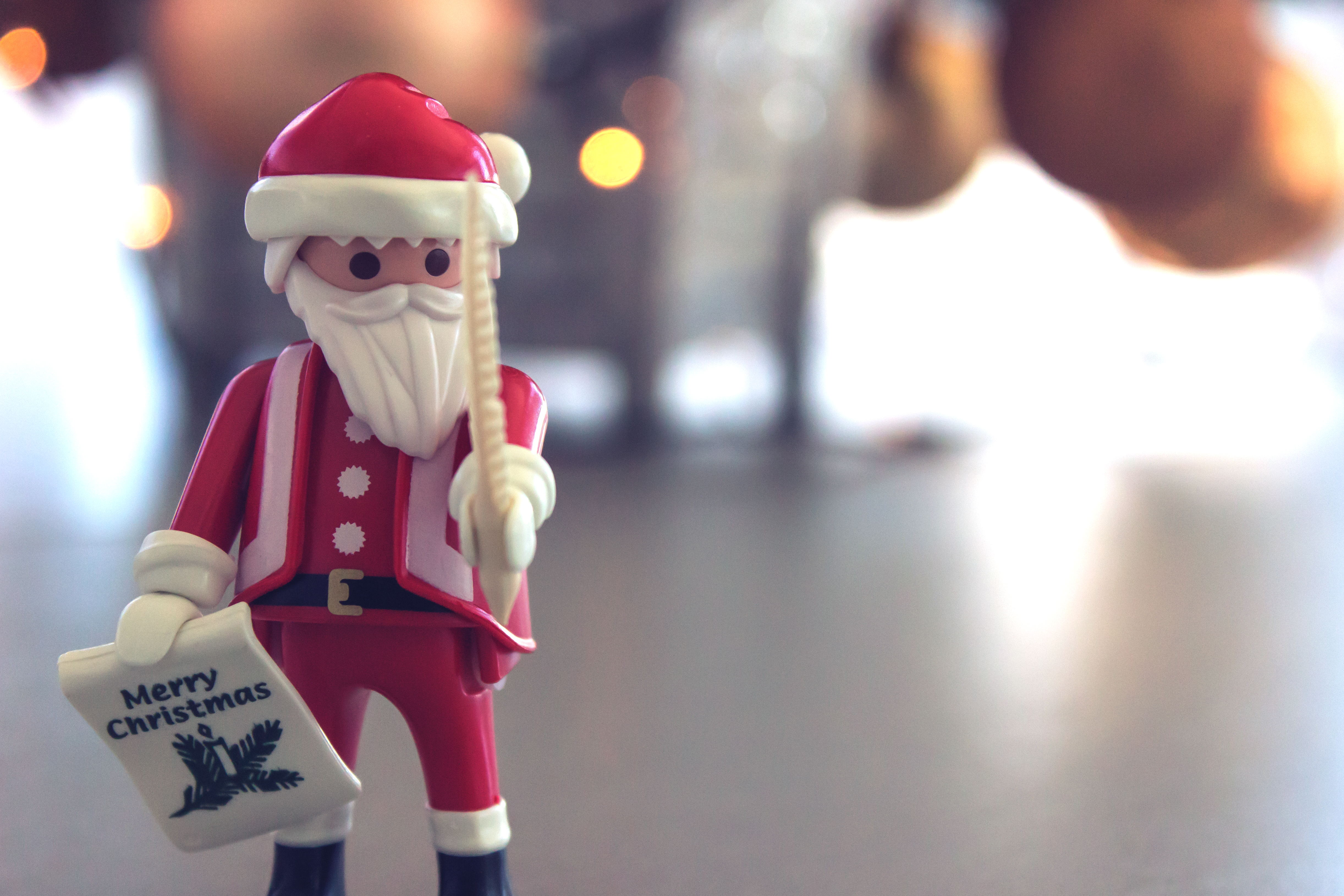 Download mobile wallpaper Glare, Holidays, Santa Claus, Smooth, Toy, Blur, Christmas for free.