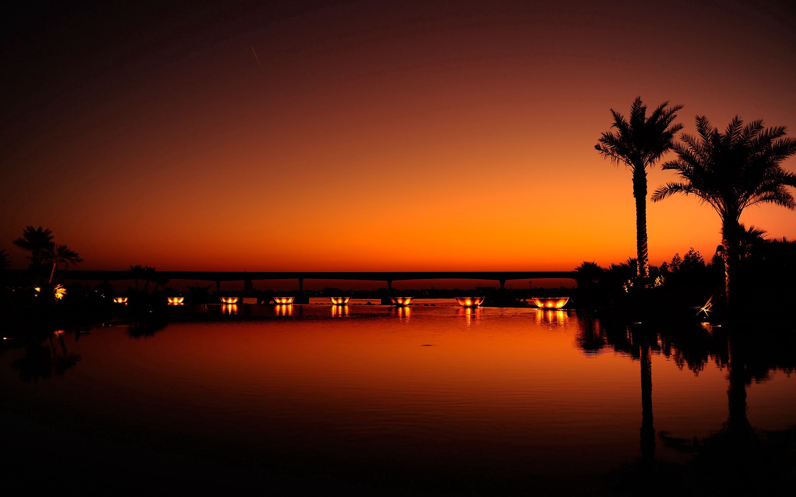 Download mobile wallpaper Reflection, Cities, Sunset, Night, Shine, Light, Palms, Dubai, Evening, Water for free.