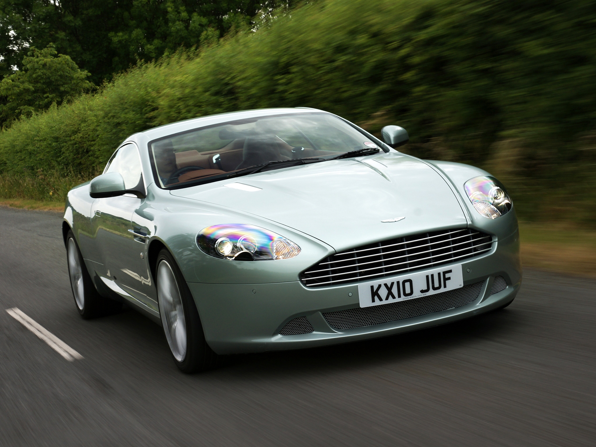 asphalt, speed, sports, auto, aston martin, cars, front view, style, shrubs, db9, 2010, green metallic cell phone wallpapers