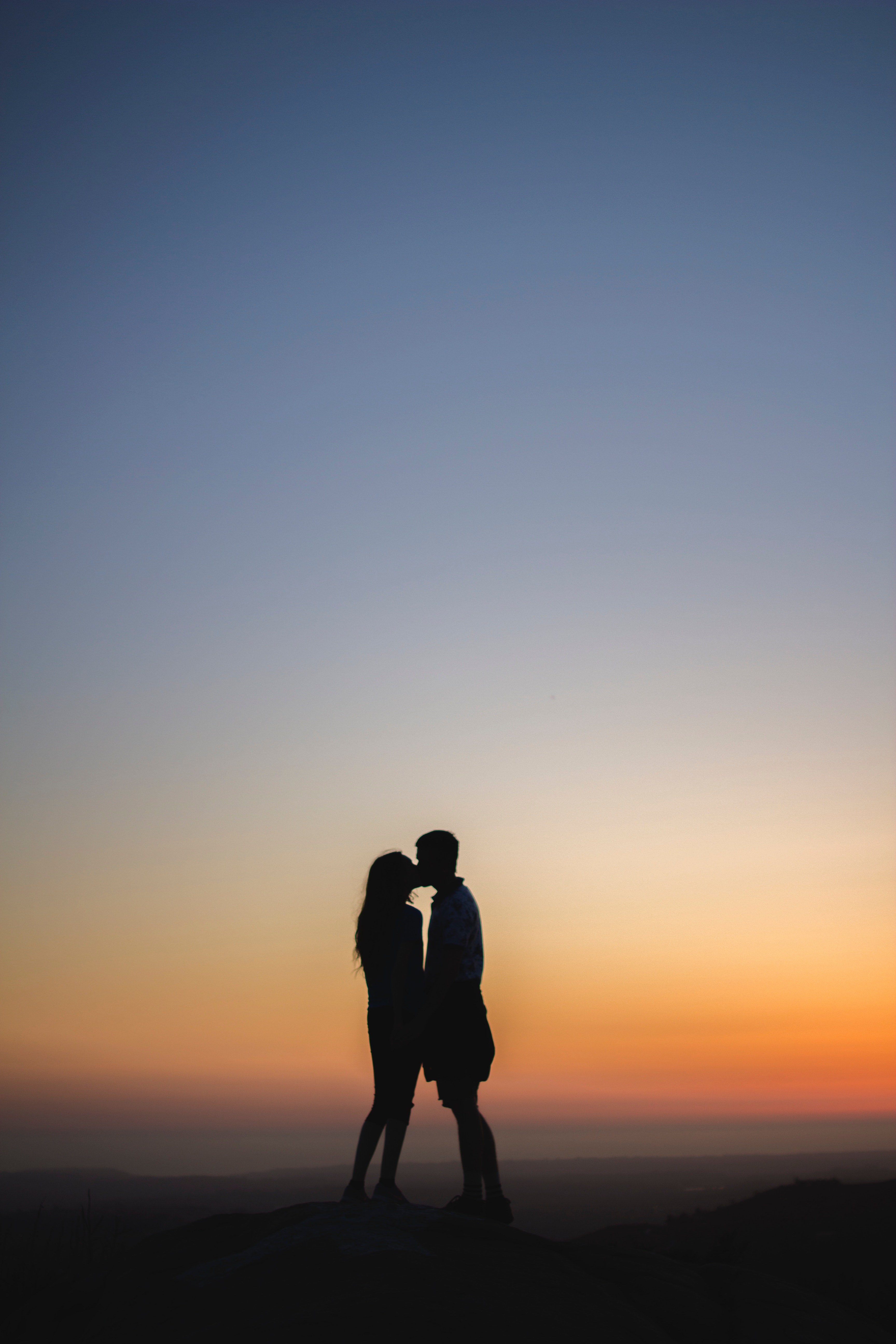 pair, silhouettes, kiss, love, couple wallpaper for mobile