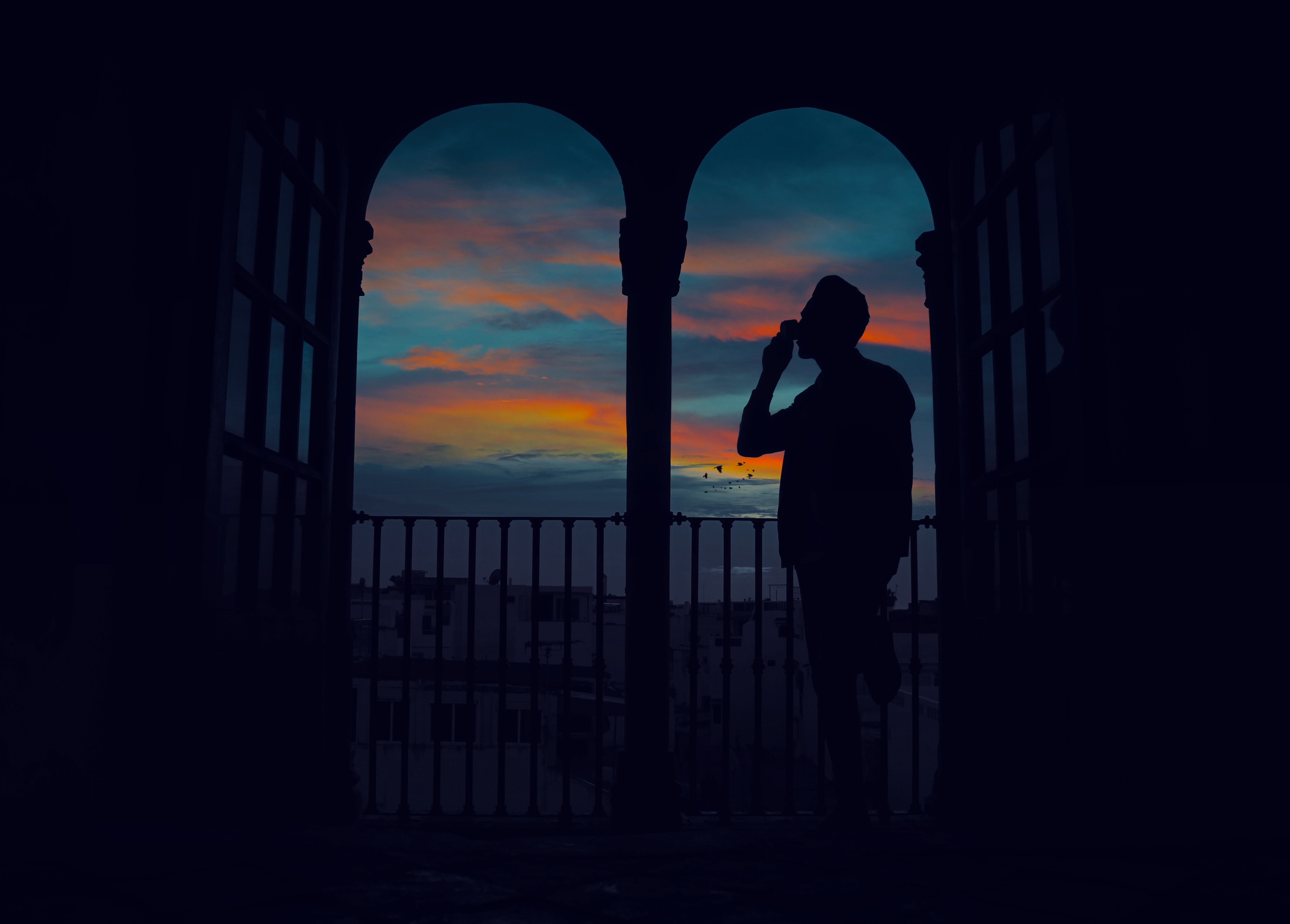 Download mobile wallpaper Twilight, Dusk, Arch, Silhouette, Man, Dark for free.