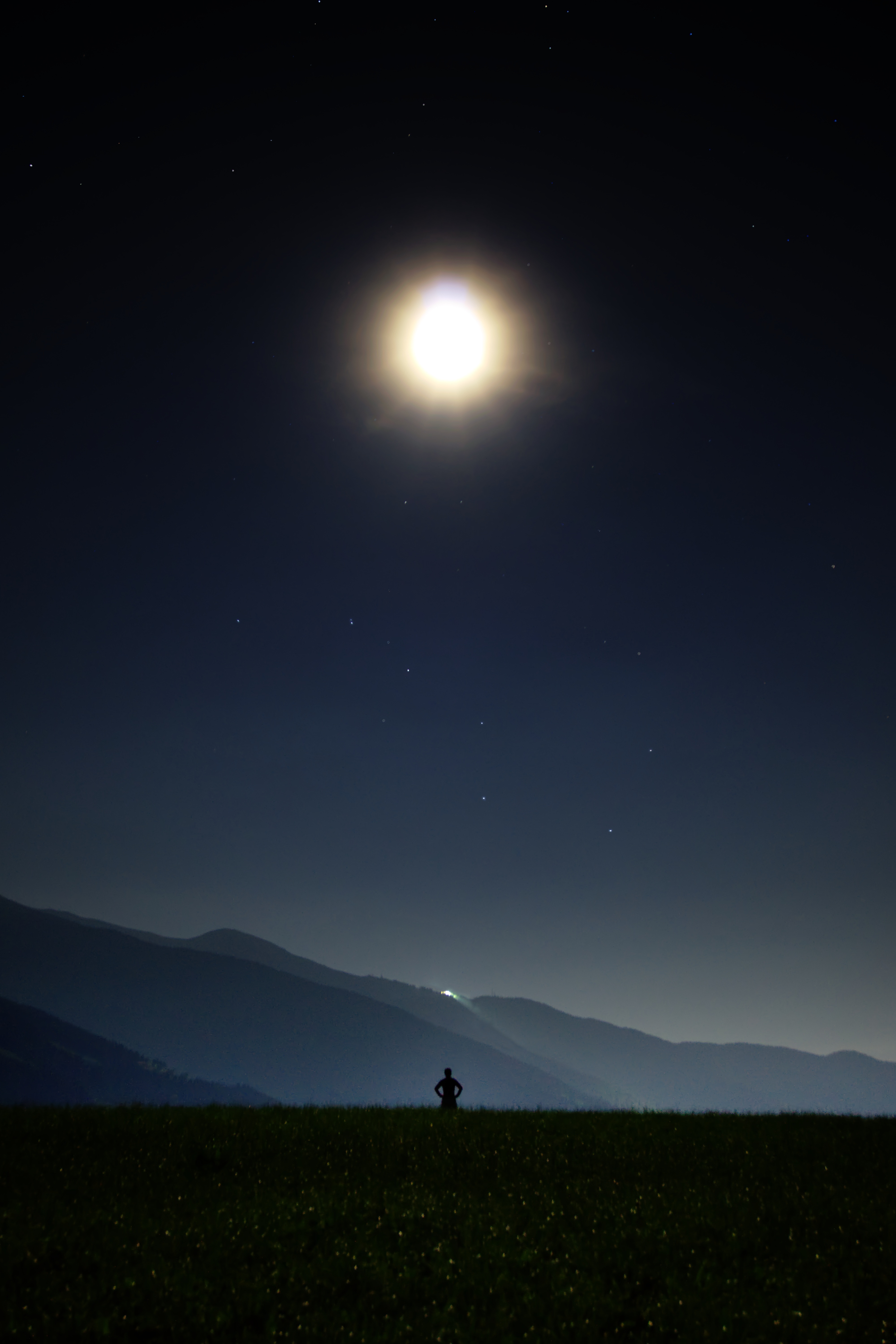 Download mobile wallpaper Field, Silhouette, Stars, Sky, Person, Human, Night, Dark for free.