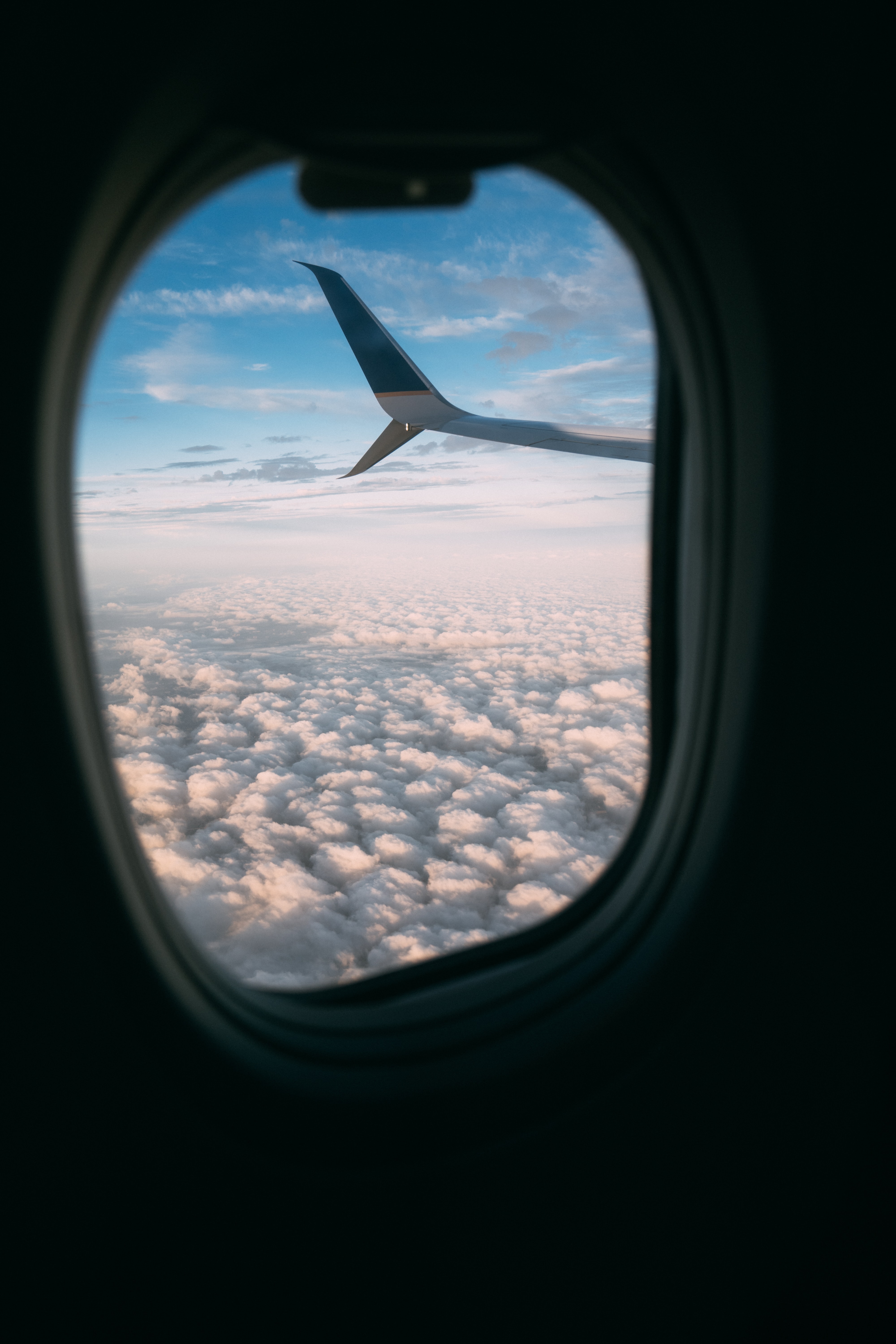 plane, clouds, porthole, miscellanea, miscellaneous, wing, airplane, view Smartphone Background