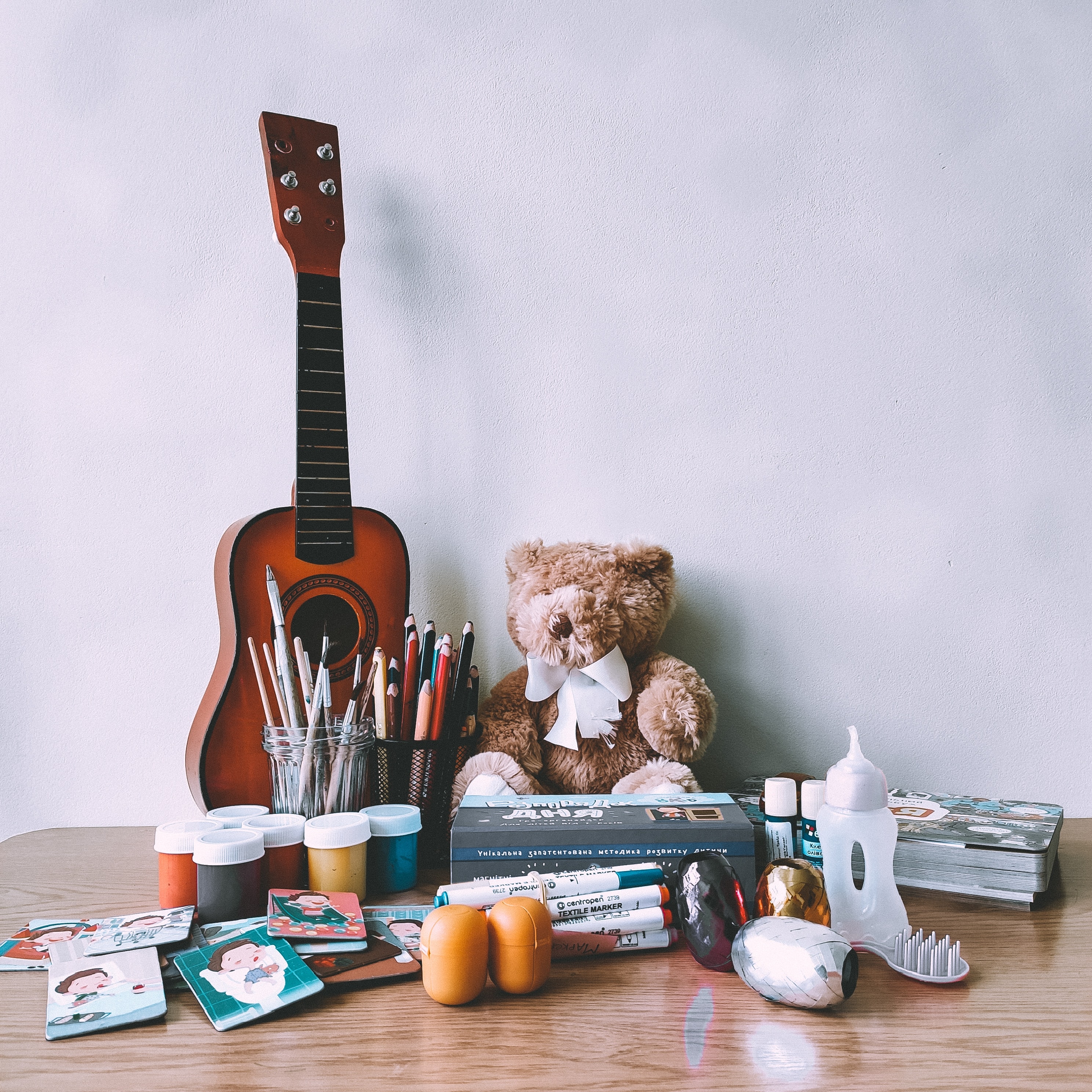 musical instrument, miscellanea, miscellaneous, toy, guitar, pencils, paints