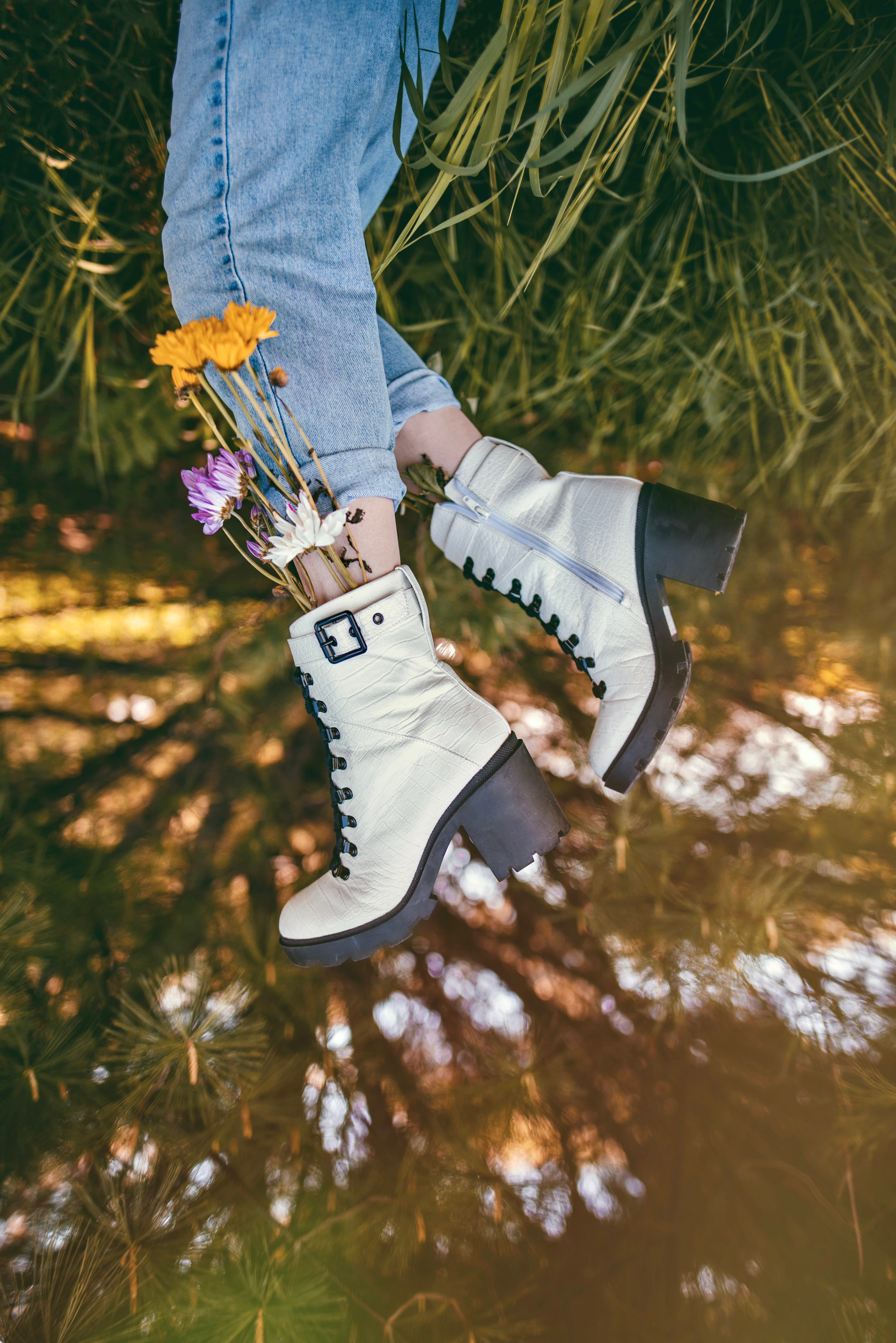 flowers, grass, miscellanea, miscellaneous, legs, boots, shoes, jeans