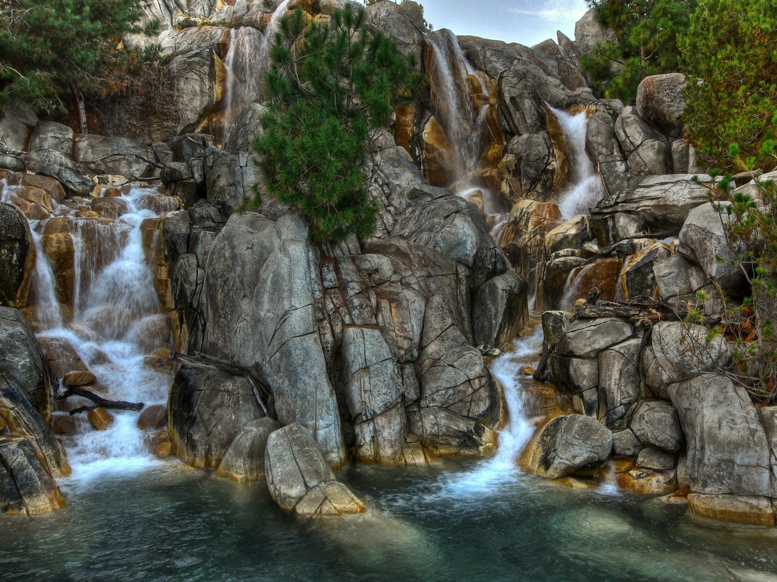 Download mobile wallpaper Greens, Stones, Vegetation, Nature, Waterfalls for free.