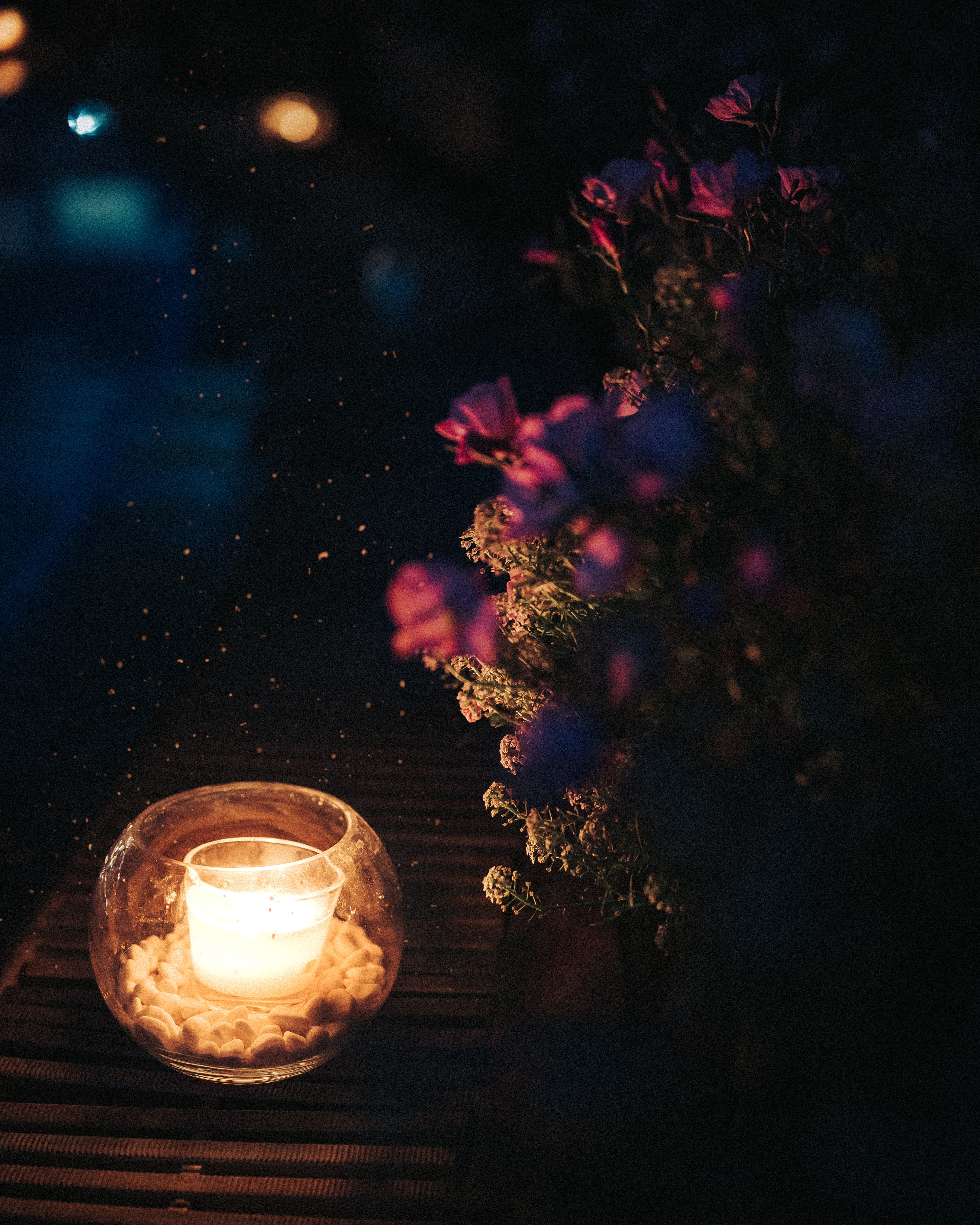 Download mobile wallpaper Sparks, Flowers, Night, Candle, Dark for free.