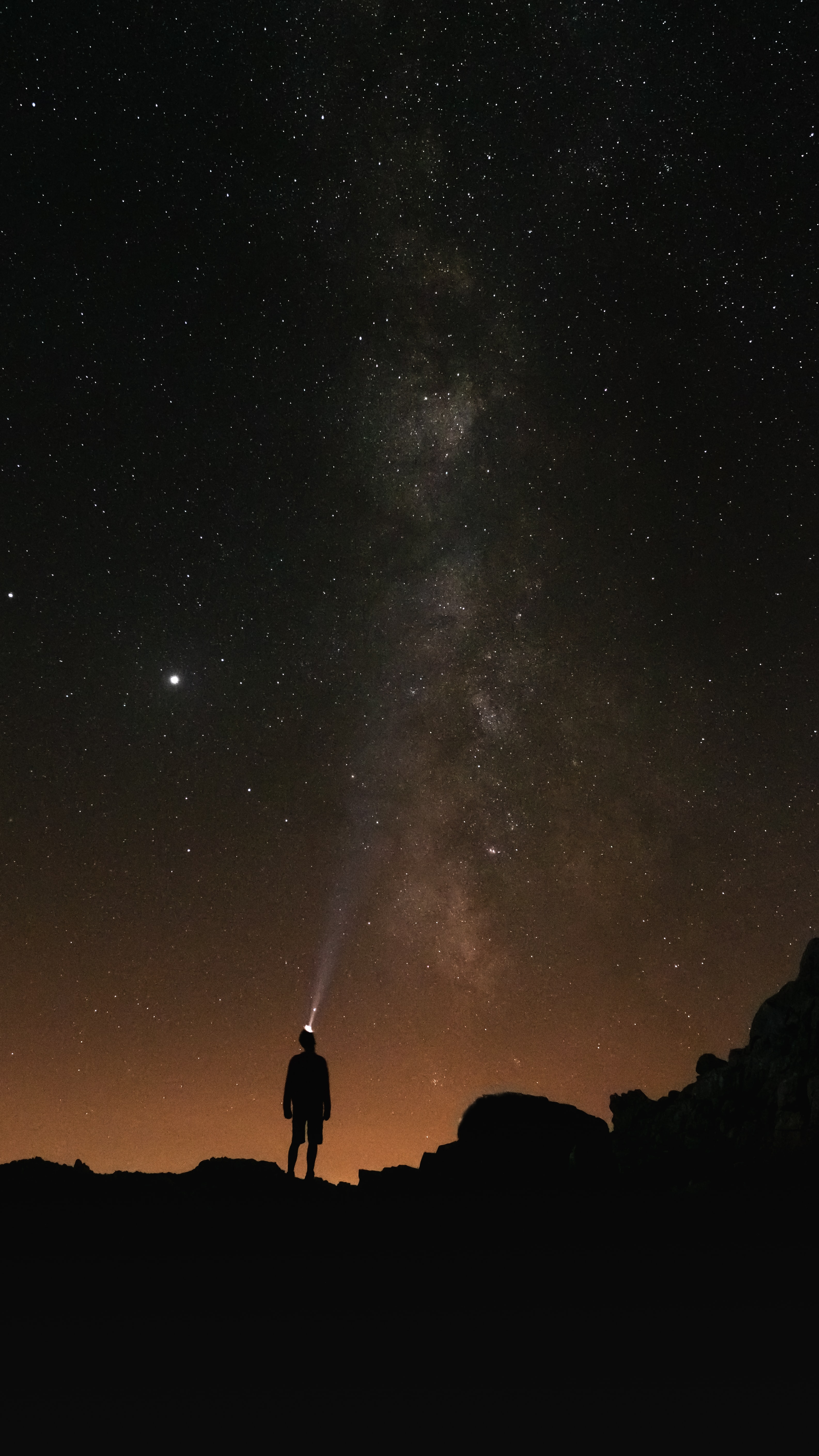 Download mobile wallpaper Flashlight, Night, Person, Starry Sky, Human, Silhouette, Dark for free.