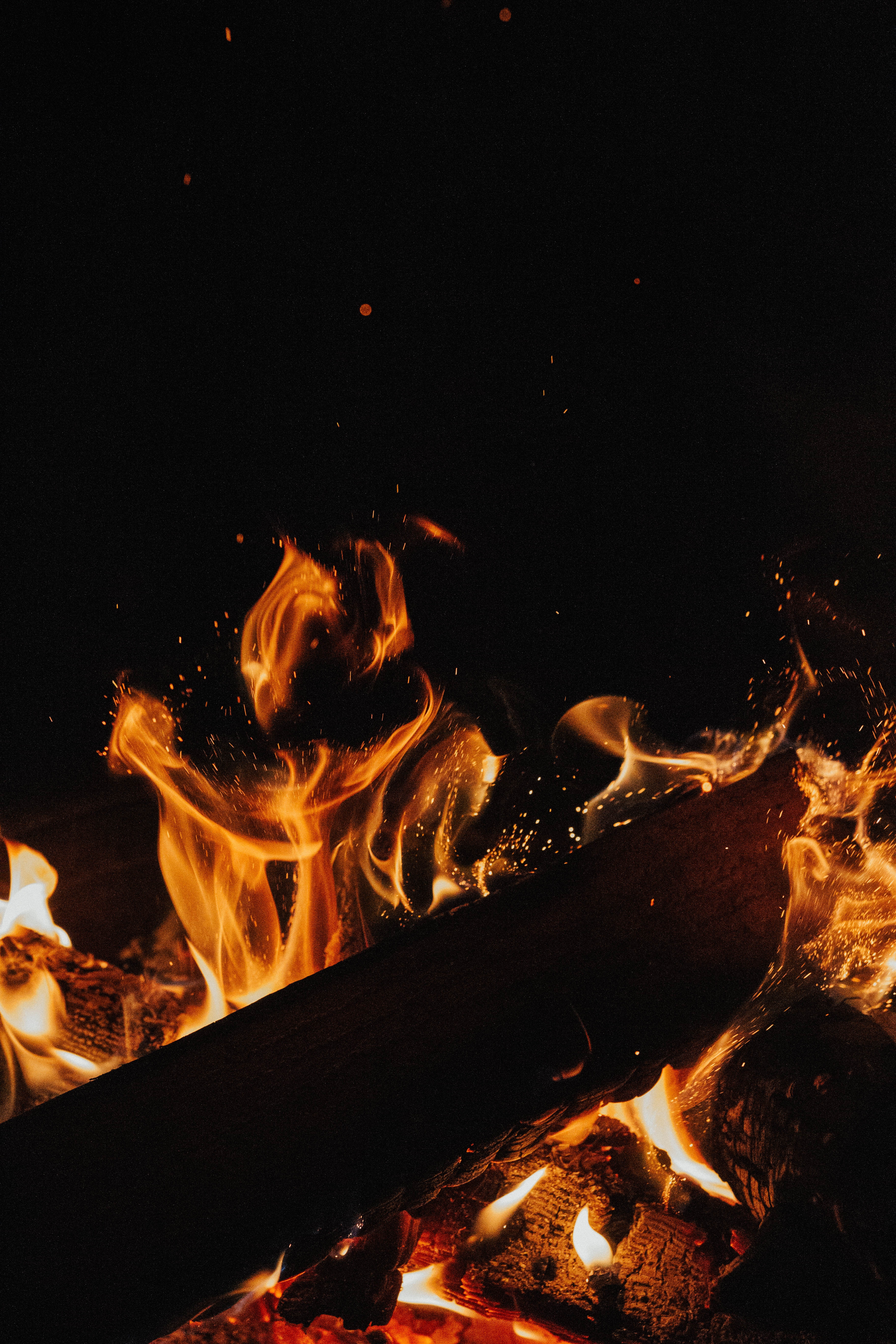 Download mobile wallpaper Coals, Sparks, Flame, Bonfire, Firewood, Fire, Dark for free.
