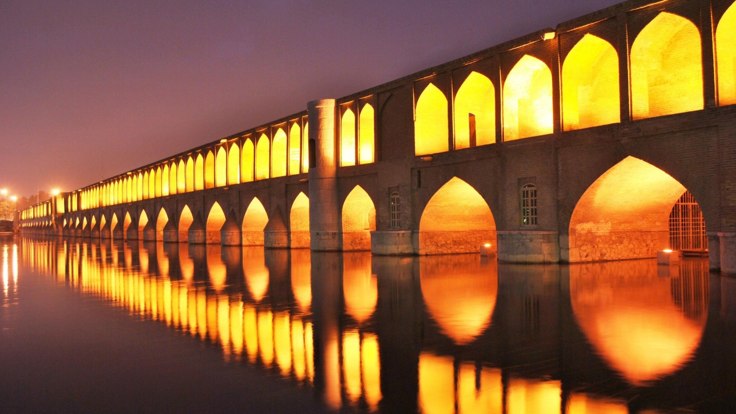 Download mobile wallpaper Isfahan, Cities, Bridge, Iran, Night, Shine, Light, Structure for free.
