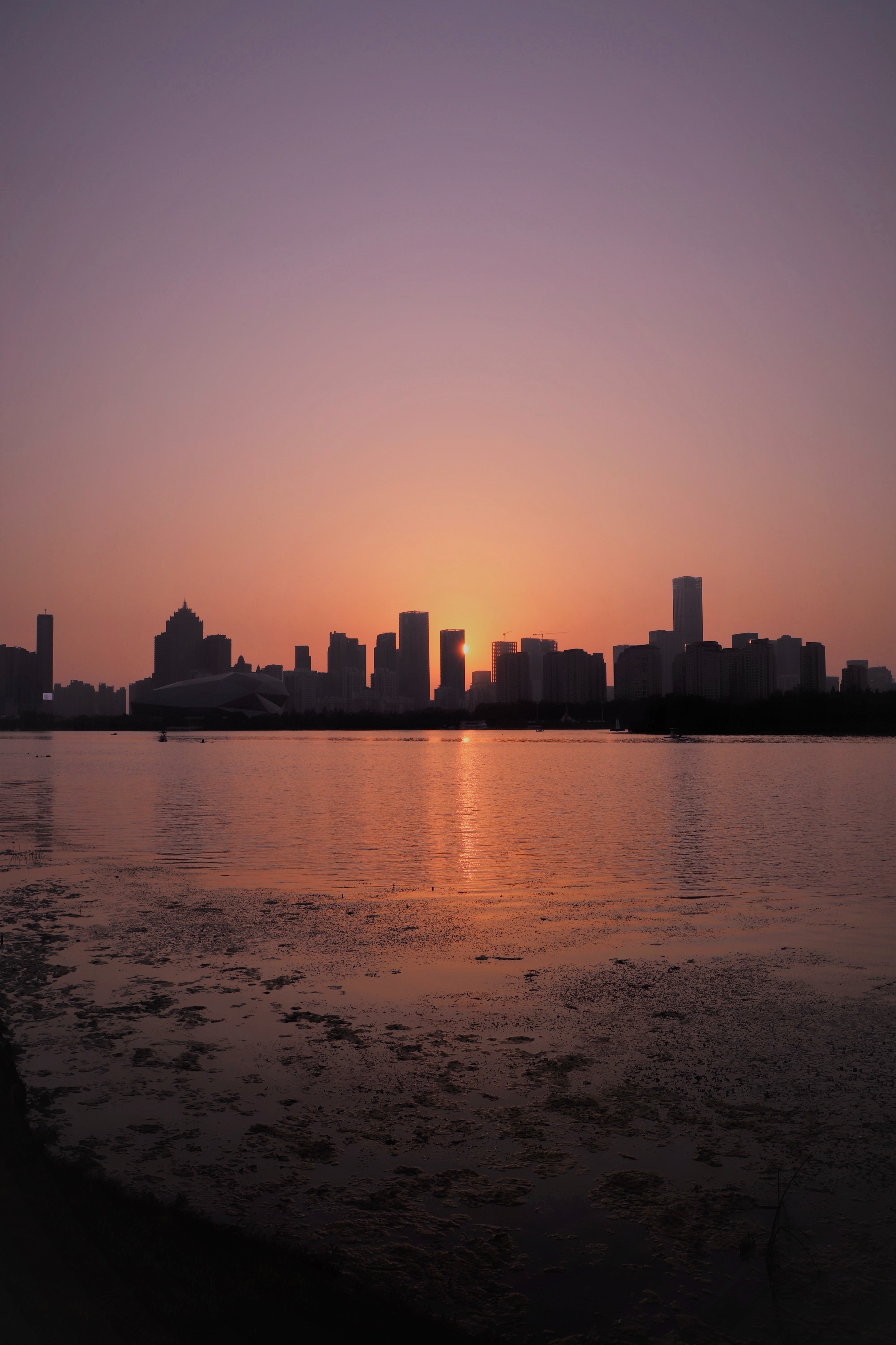 Download PC Wallpaper sunset, cities, sea, city, building, beams, rays