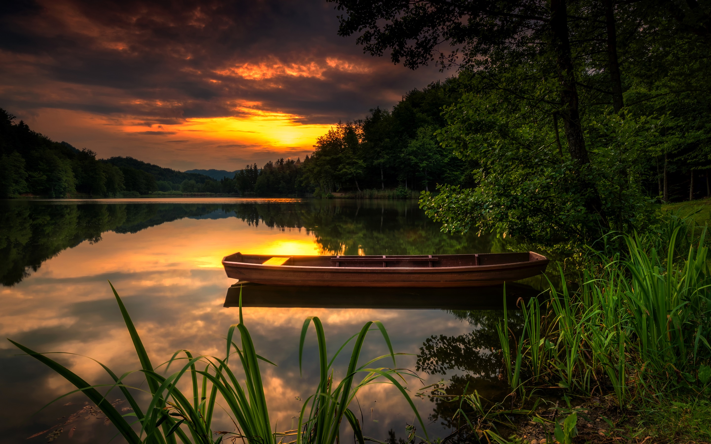 Download mobile wallpaper Sunset, Lake, Reflection, Boat, Vehicles for free.