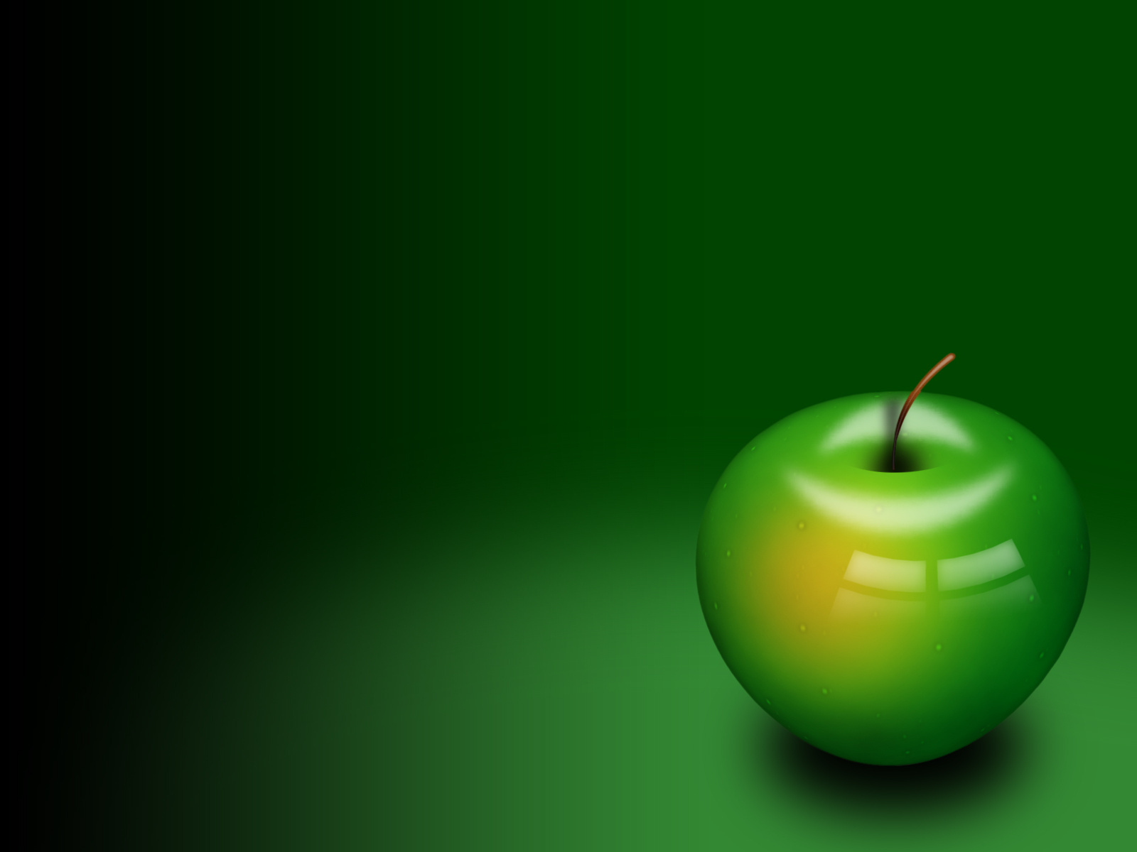 Яблоко на зеленом фоне