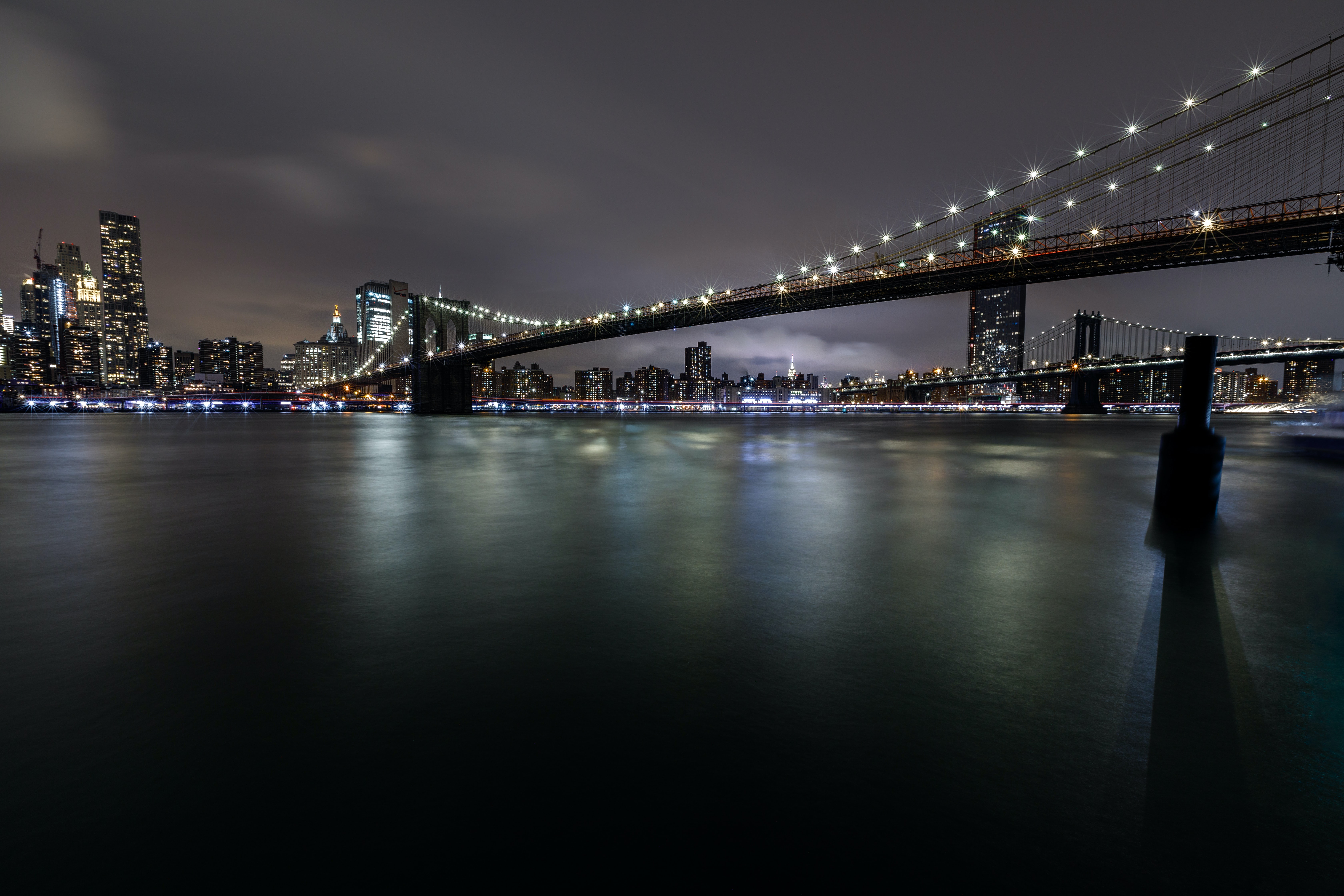 Download mobile wallpaper Building, Bridge, Cities, Night City, Lights, Rivers, Glow for free.