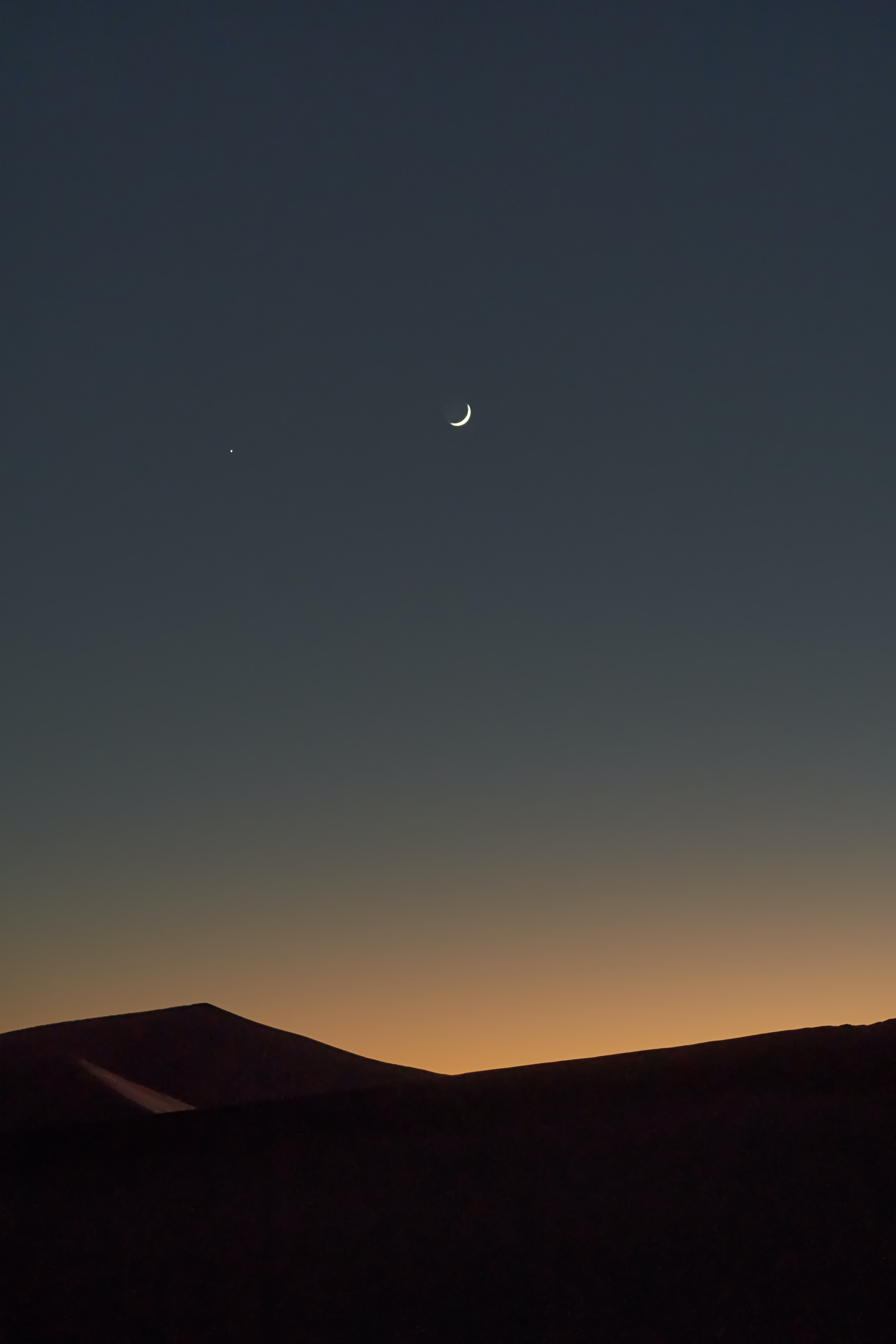 Download mobile wallpaper Hills, Moon, Relief, Dusk, Twilight, Nature for free.