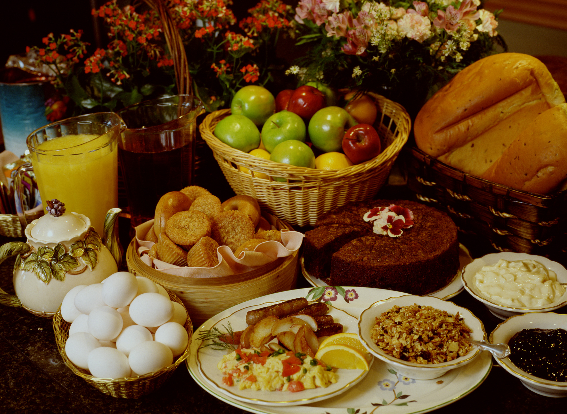 bread, food, meal, apple, chocolate cake, egg, juice, sausage, tea