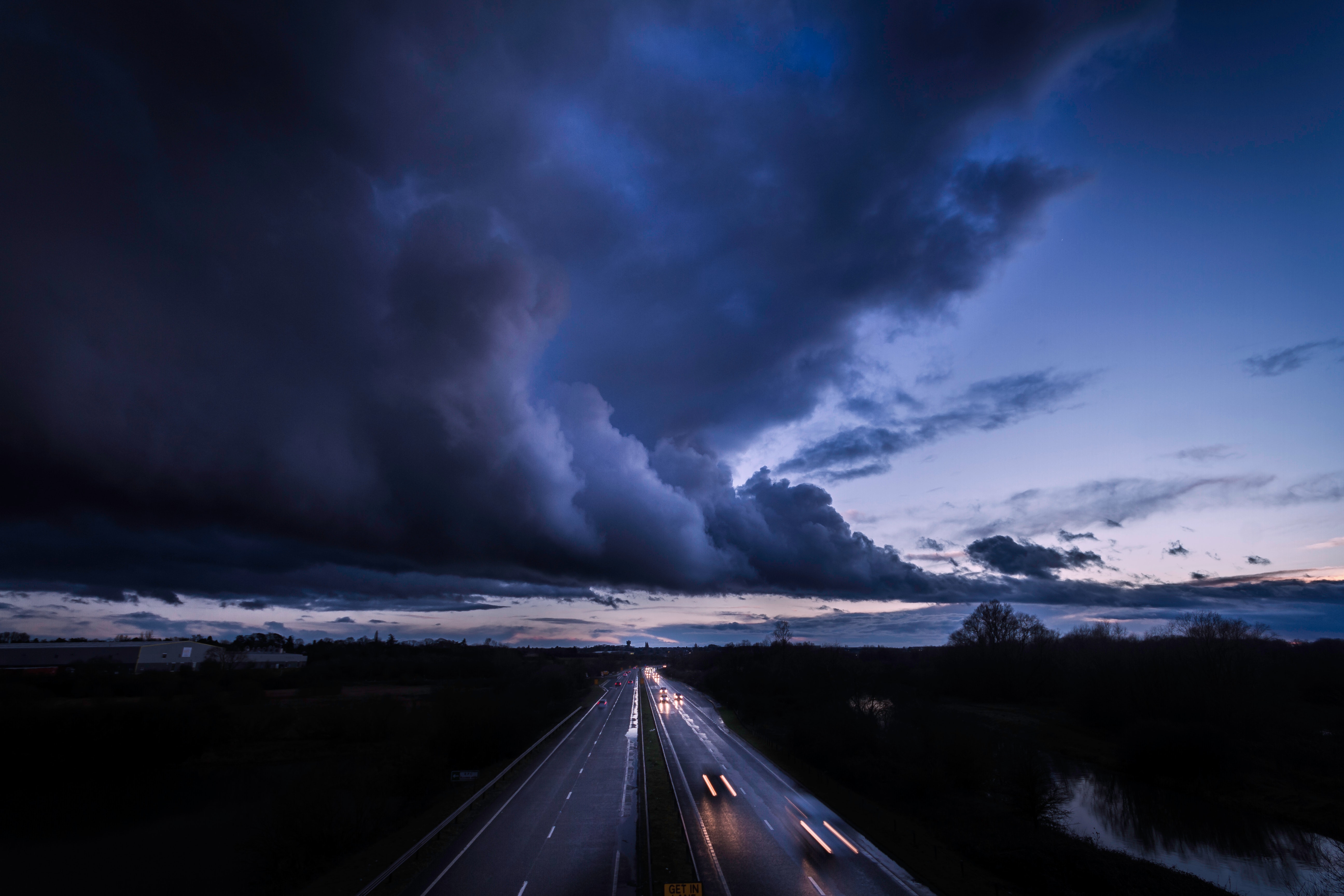 Free download wallpaper Clouds, Traffic, Movement, Overcast, Horizon, Mainly Cloudy, Cities, Road on your PC desktop