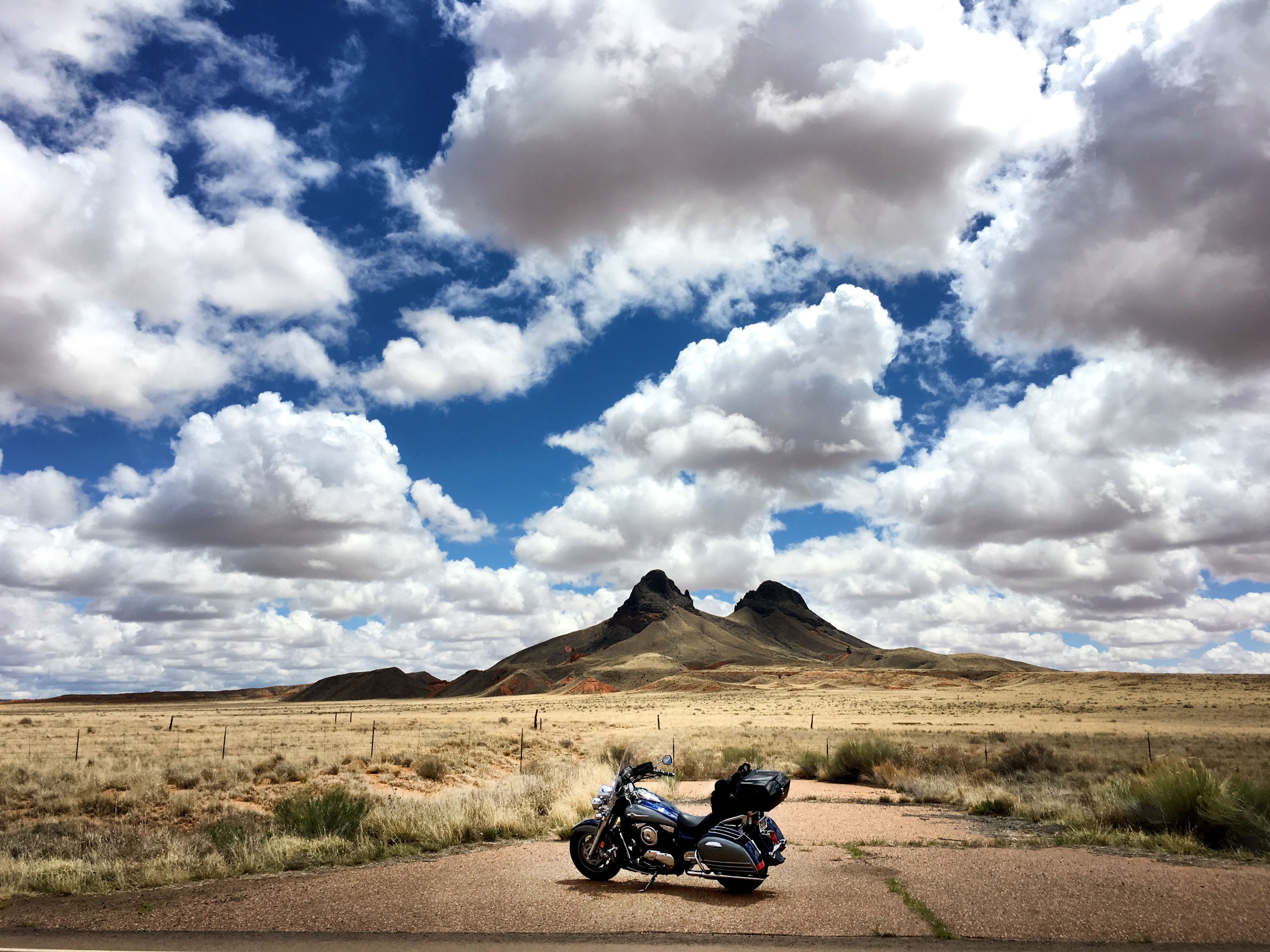 Download mobile wallpaper Clouds, Journey, Desert, Mountains, Motorcycle, Motorcycles for free.