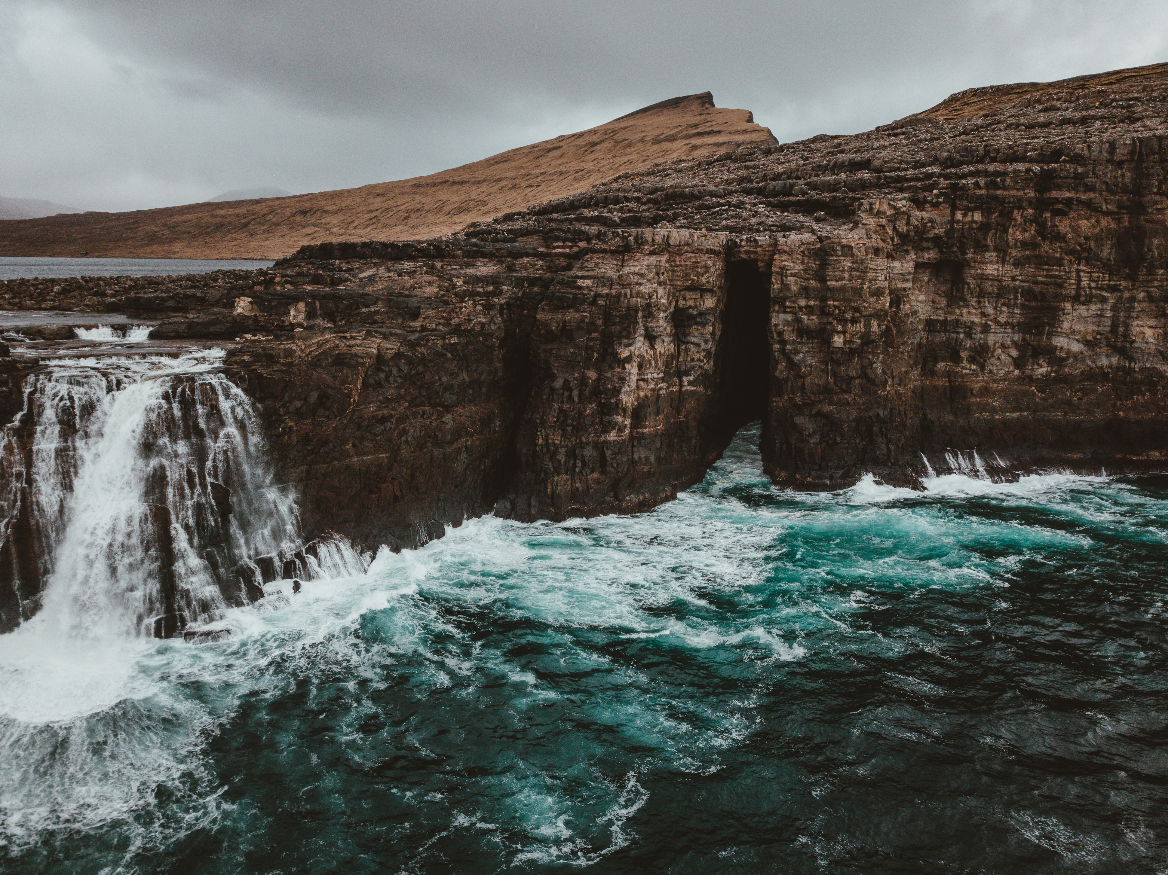 Download mobile wallpaper Watnavegur, Faroe Islands, Foam, Rocks, Flow, Waterfall, Nature for free.