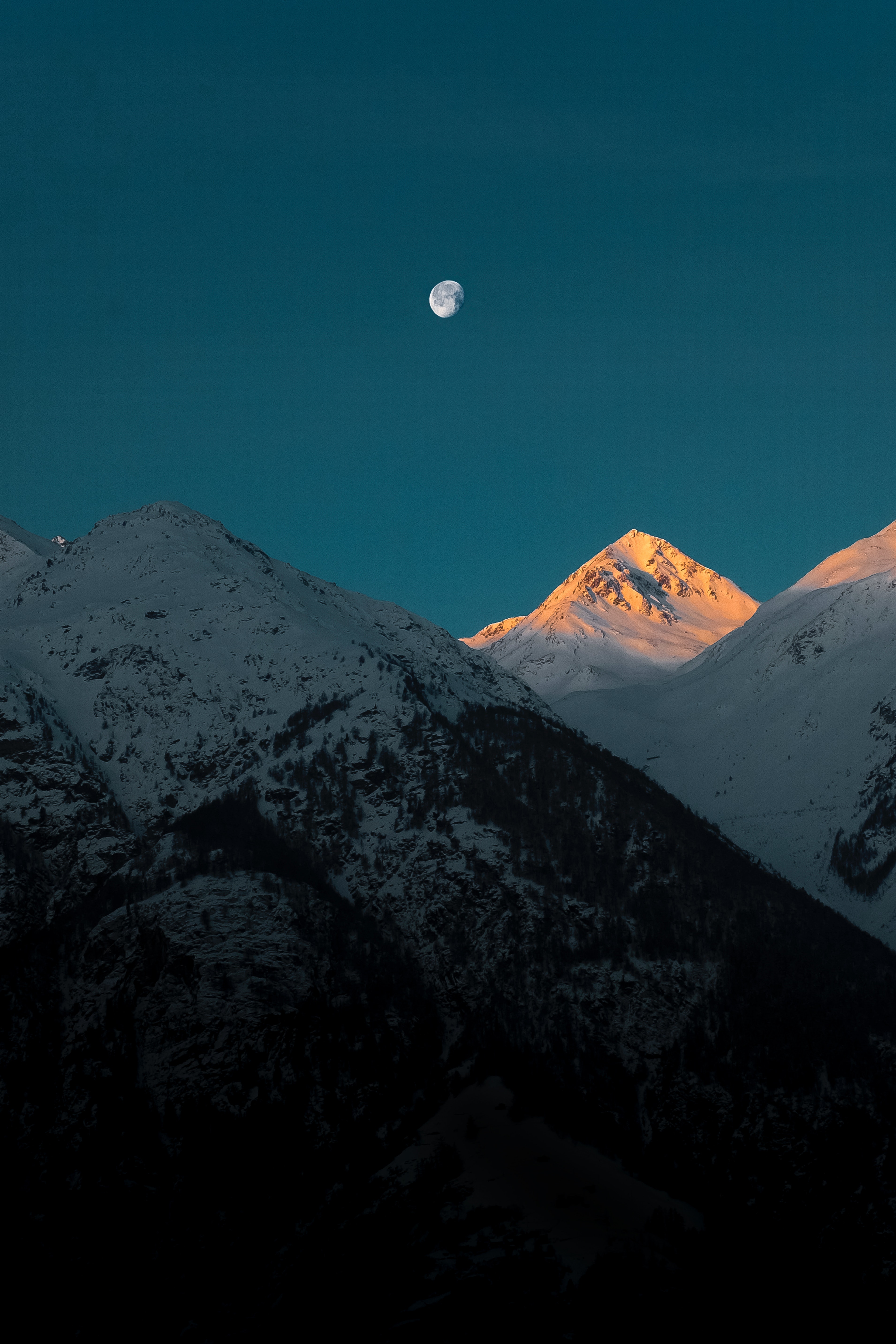 Download mobile wallpaper Mountains, Vertex, Top, Snowbound, Dusk, Snow Covered, Twilight, Nature, Moon for free.