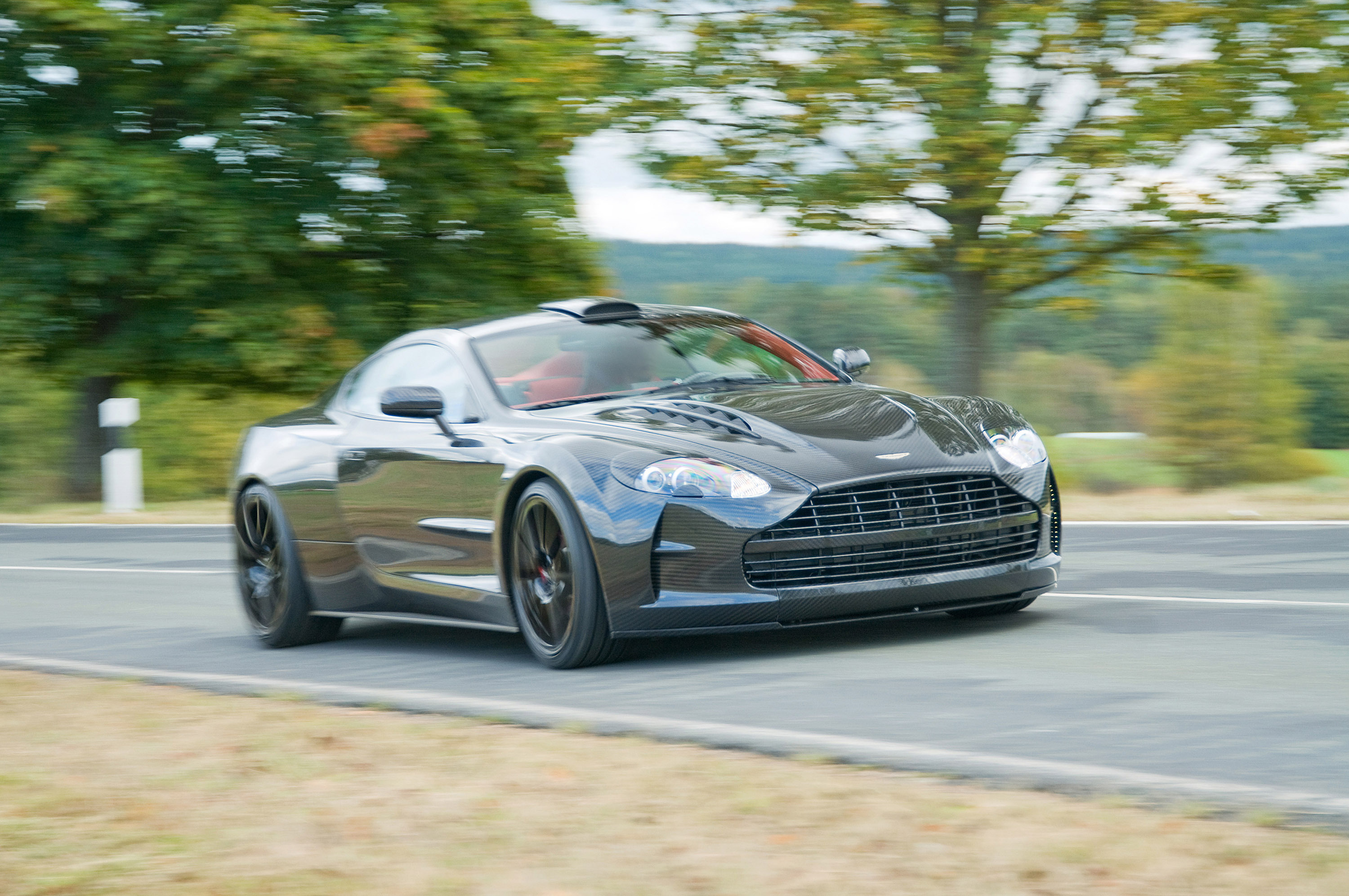 Download mobile wallpaper Traffic, Db9, Movement, Smooth, Speed, Cars, Aston Martin, Blur for free.