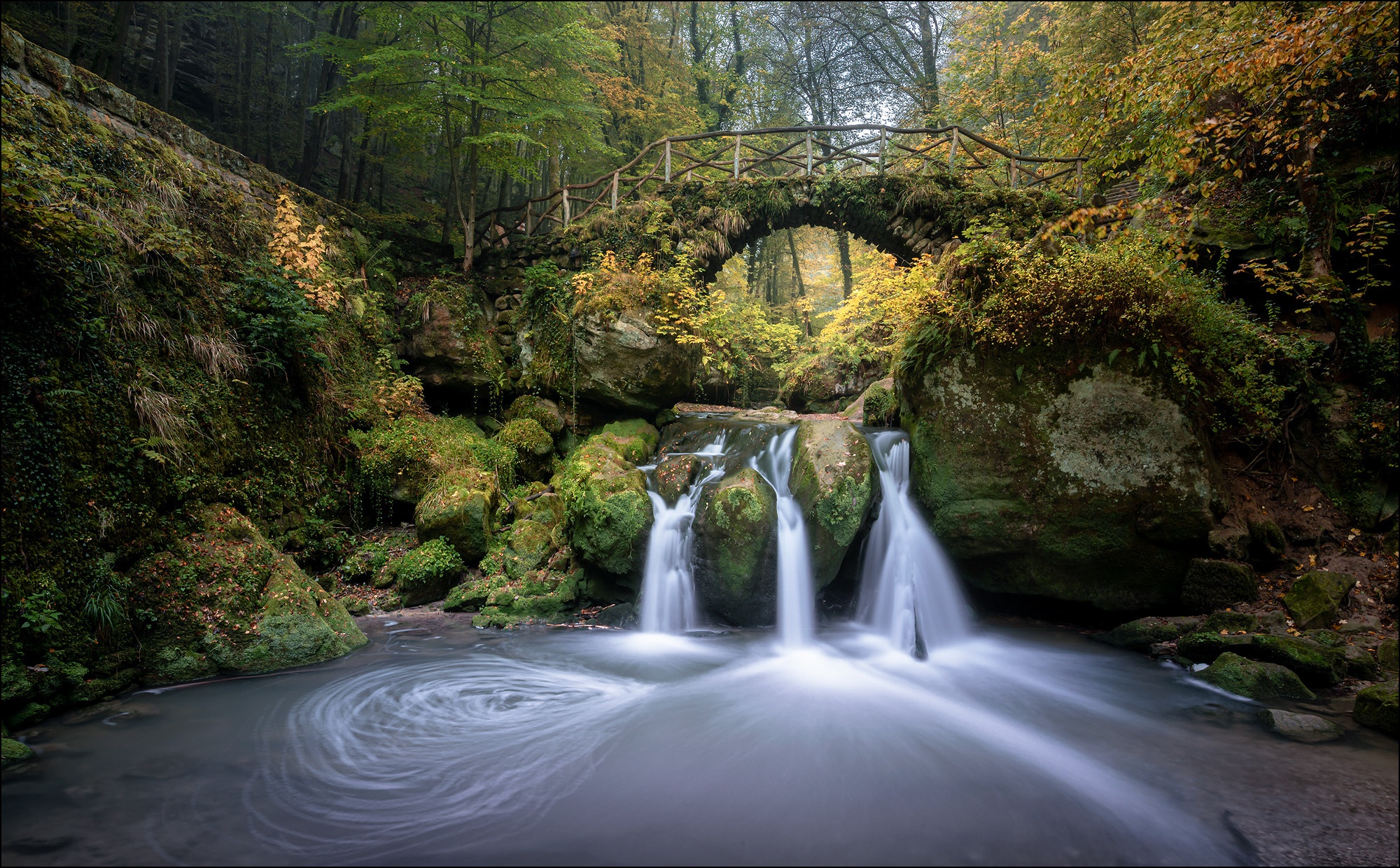 Download mobile wallpaper Nature, Waterfalls, Waterfall, Earth, Bridge, River for free.
