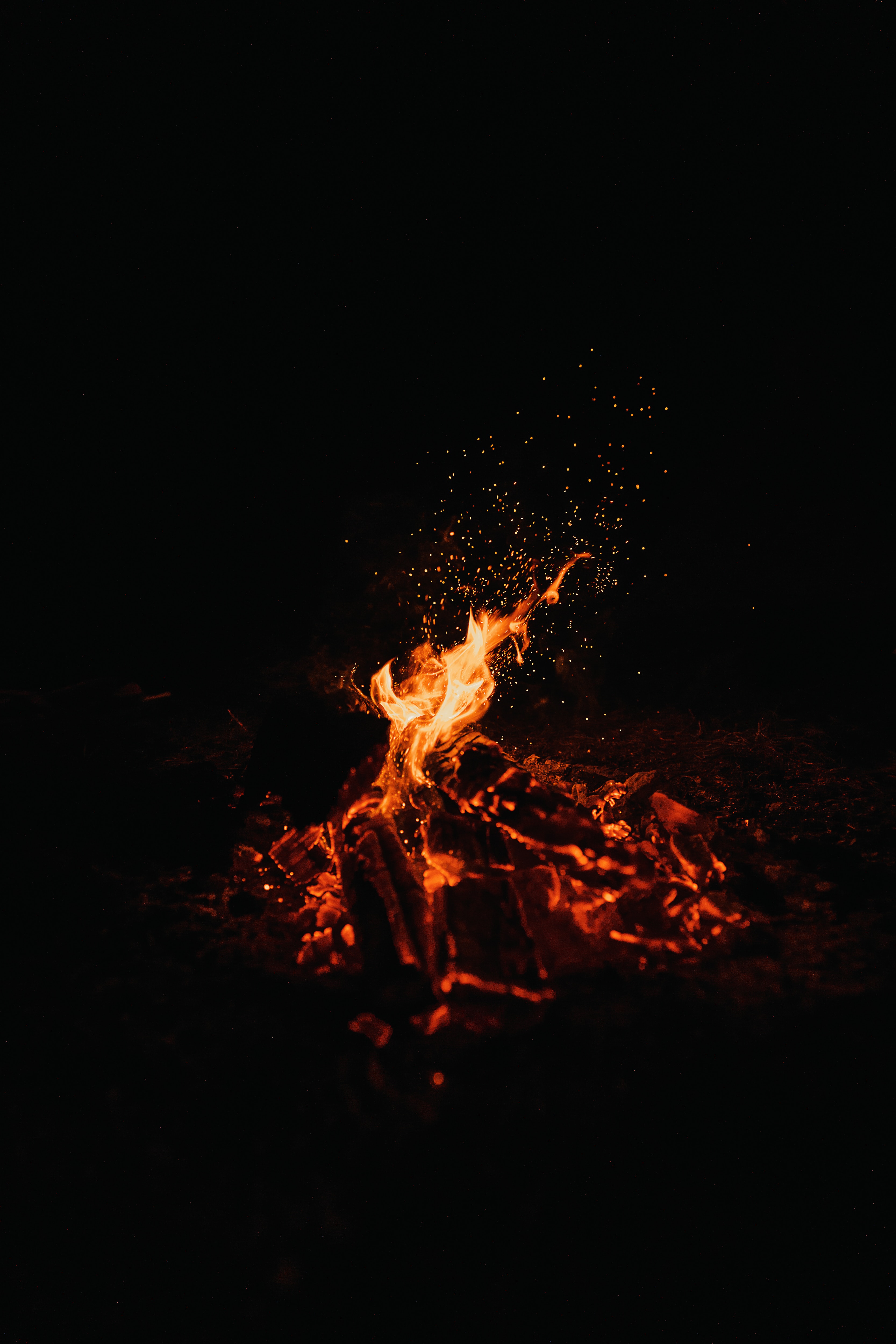 Mobile wallpaper fire, bonfire, sparks, dark, night