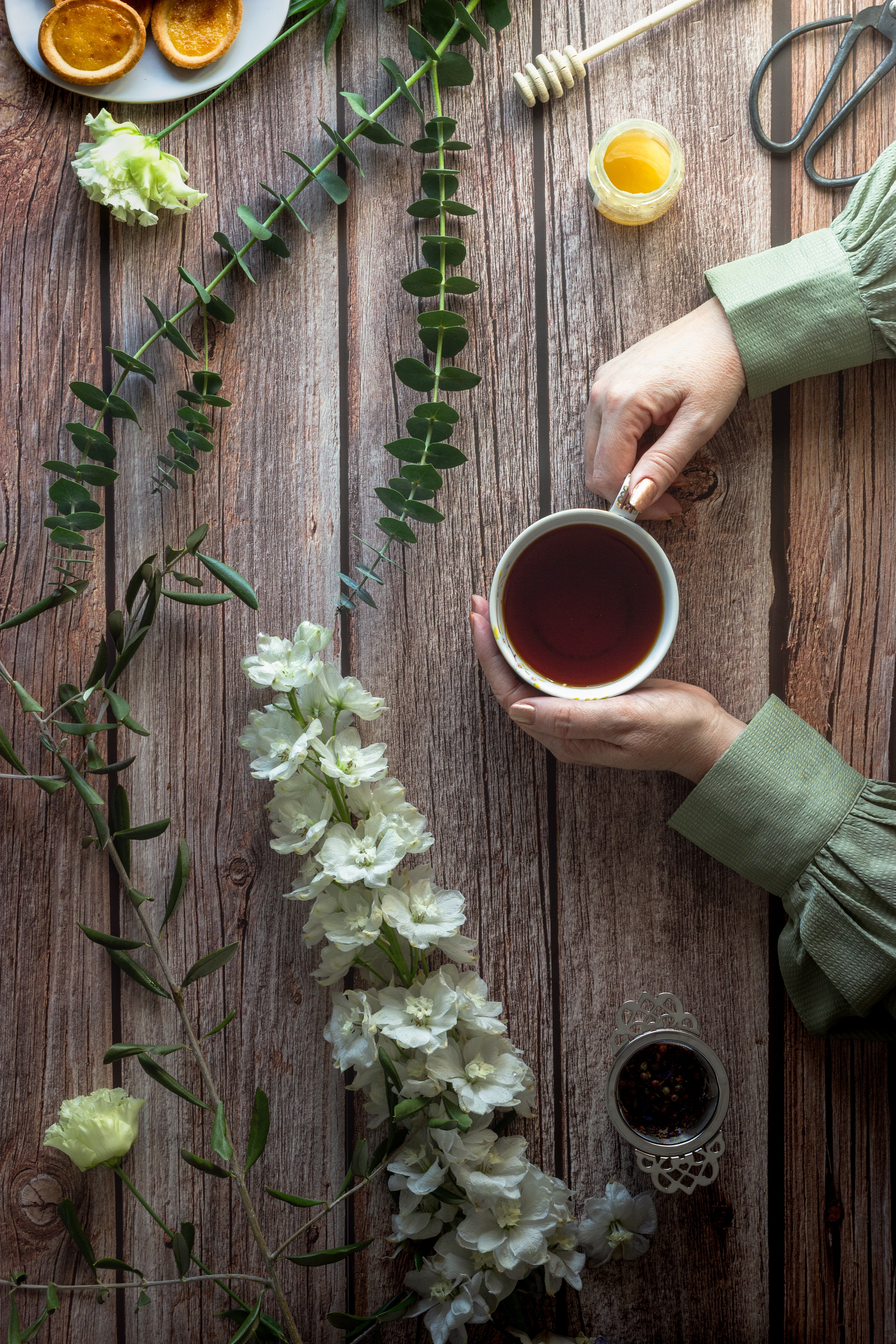 Download mobile wallpaper Cup, Tea, Miscellanea, Miscellaneous, Honey, Hands, Flowers for free.