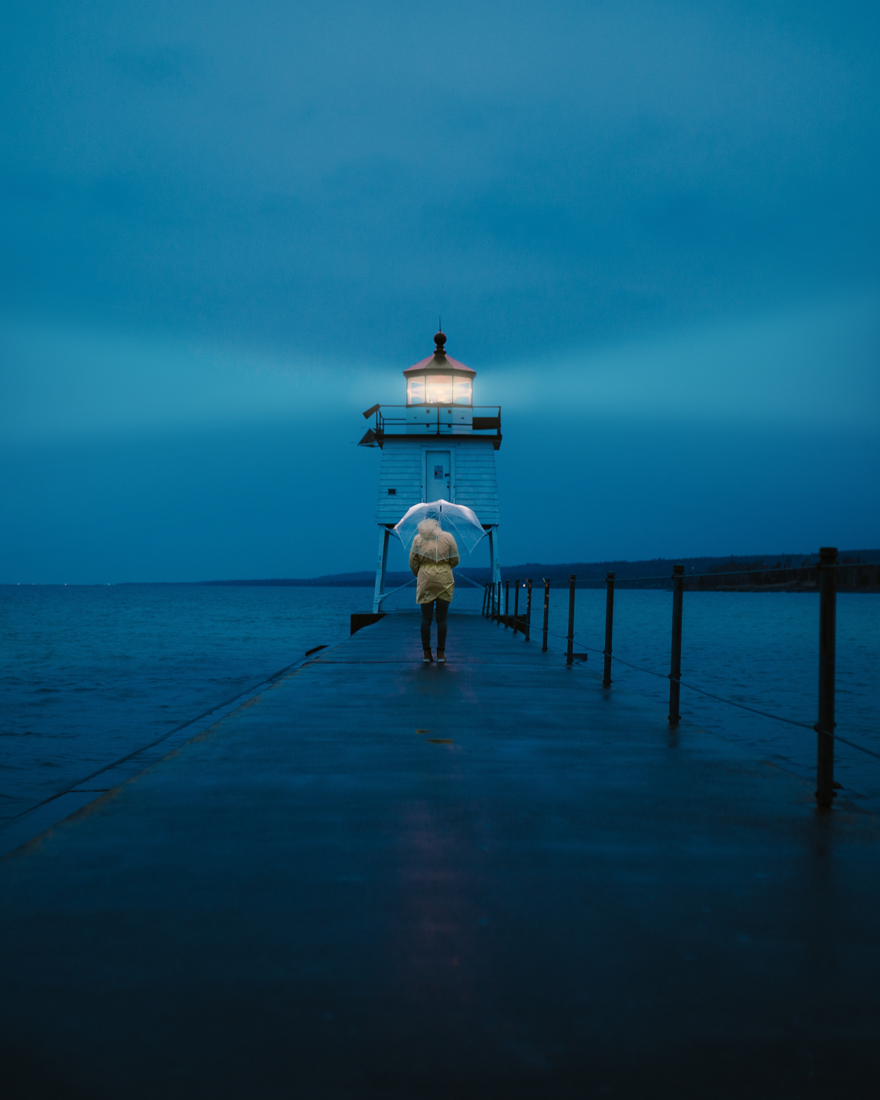 person, umbrella, sea, twilight, pier, miscellanea, miscellaneous, dusk, lighthouse, human