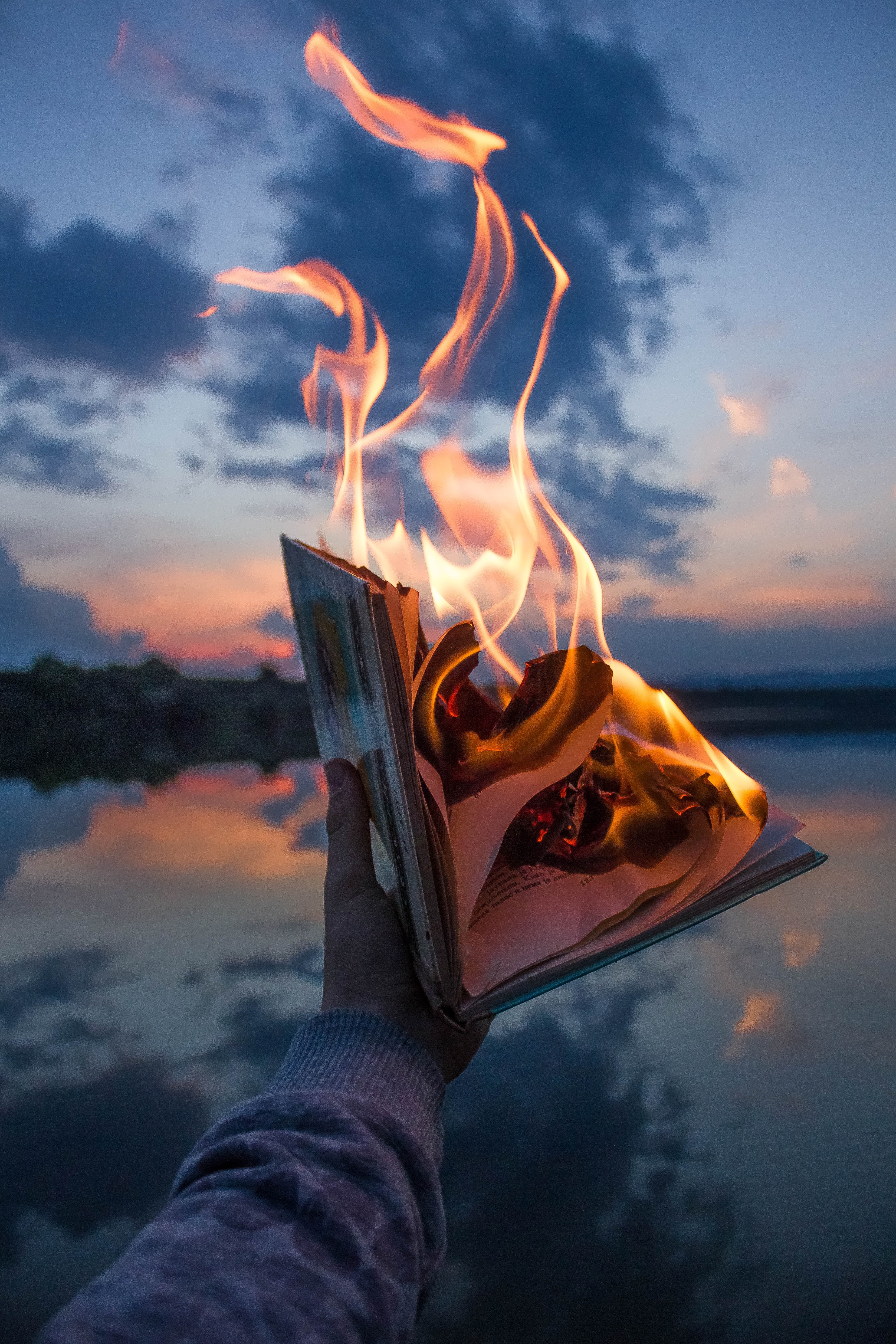 miscellanea, hand, twilight, flame, fire, dusk, miscellaneous, book wallpaper for mobile