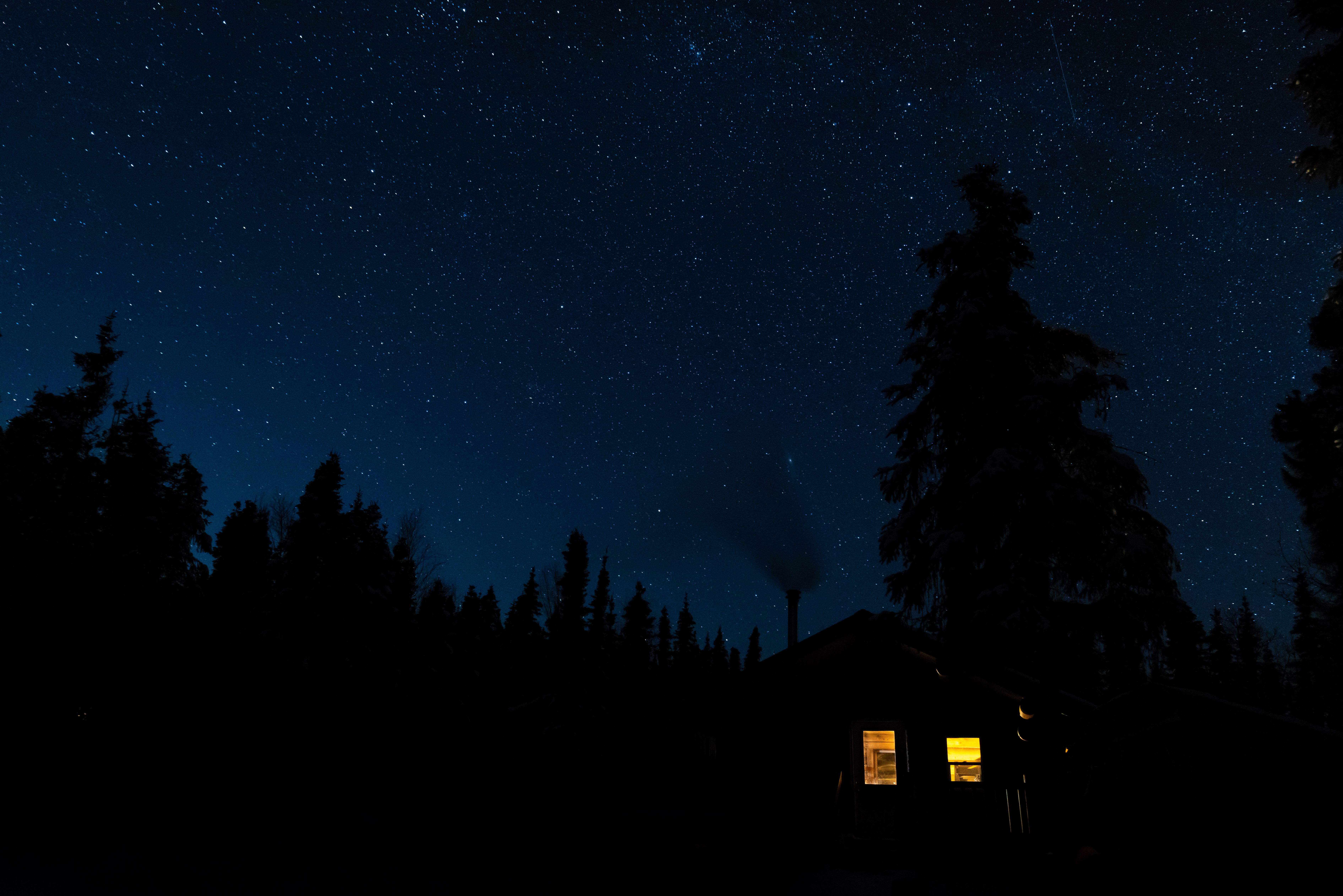 Download mobile wallpaper Forest, Lodge, Trees, Shine, Light, Night, Small House, Silhouettes, Dark for free.