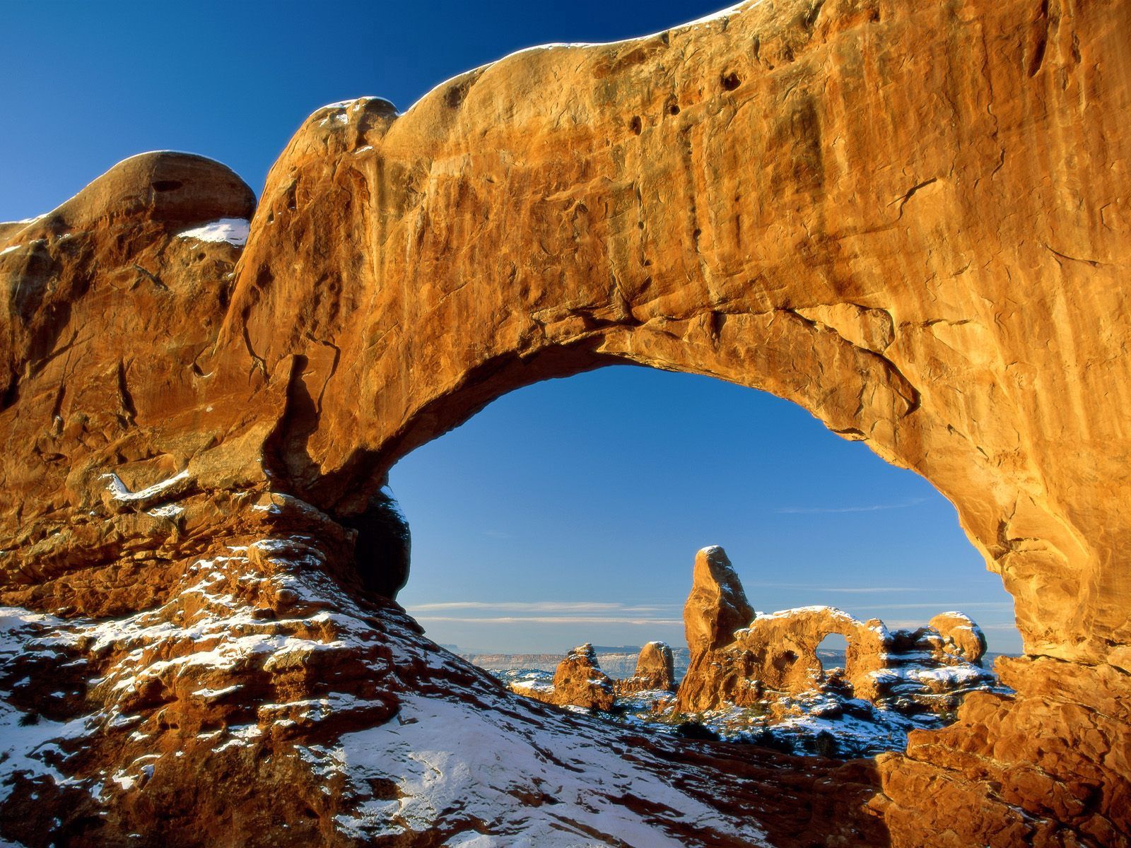 Download mobile wallpaper Stones, Snow, Window, Arch, Mountains, Nature, Canyon for free.