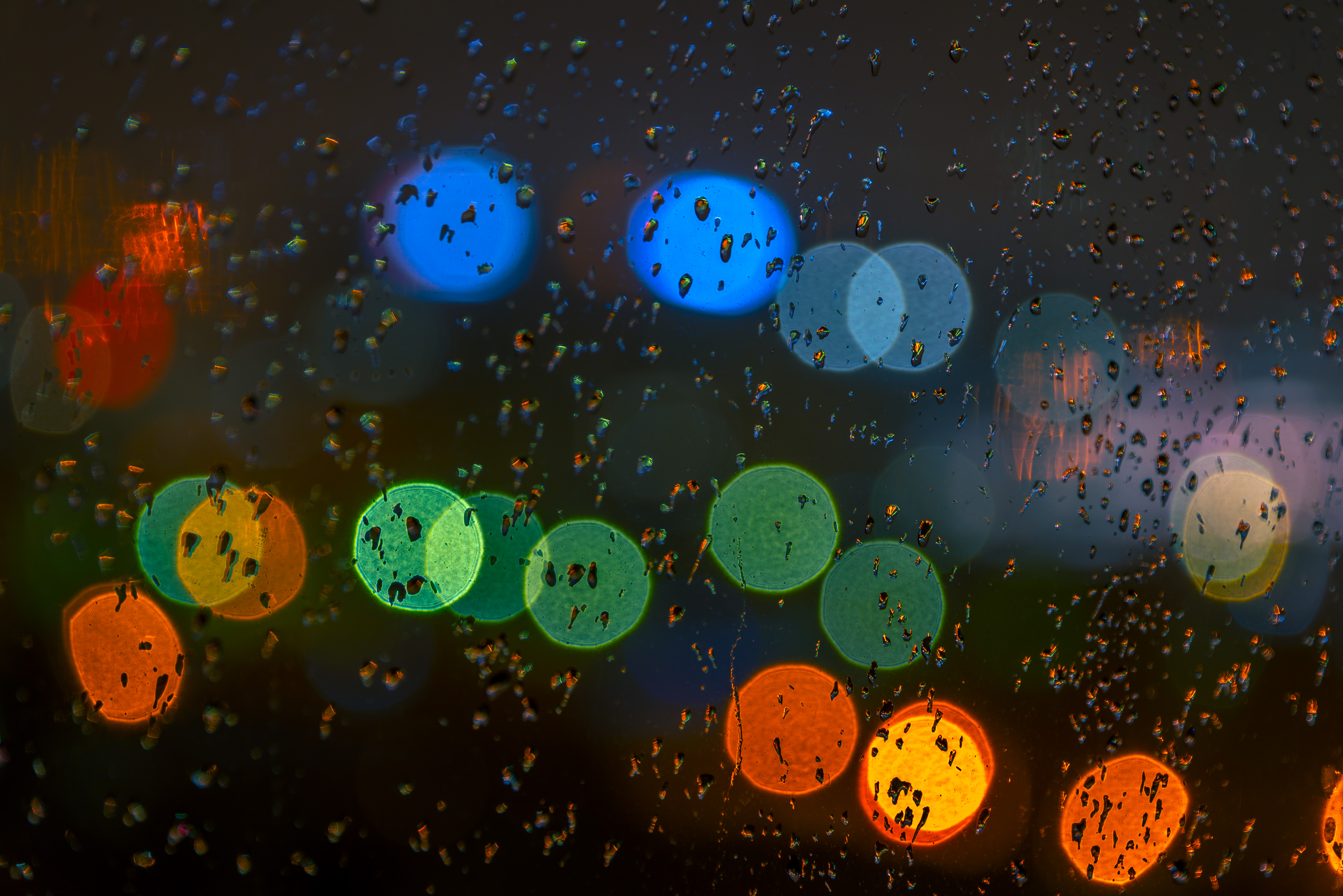 Download mobile wallpaper Glare, Abstract, Motley, Multicolored, Drops, Glass, Rain for free.