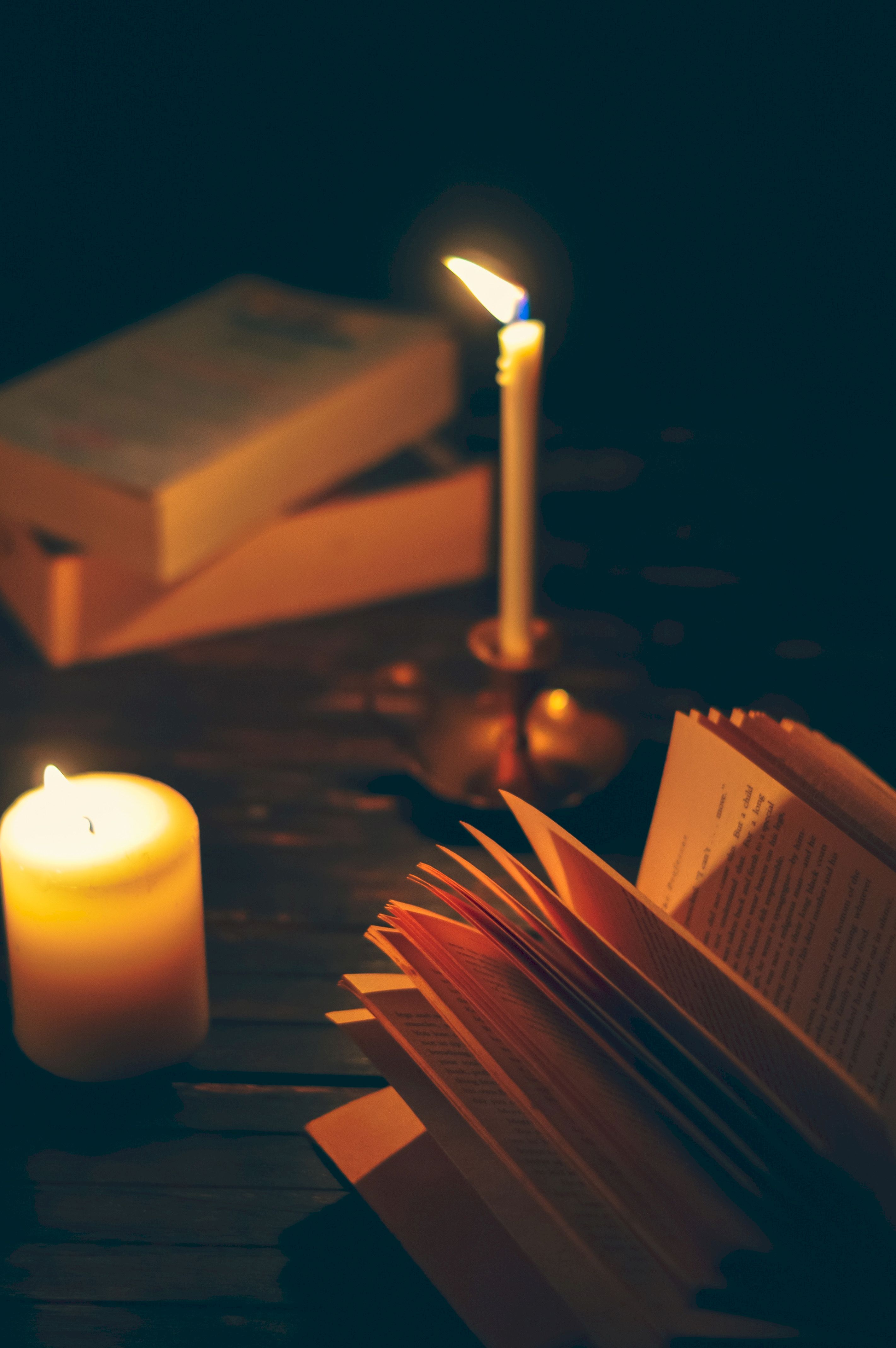 reading, book, dark, shadows, coziness, comfort, candle cellphone