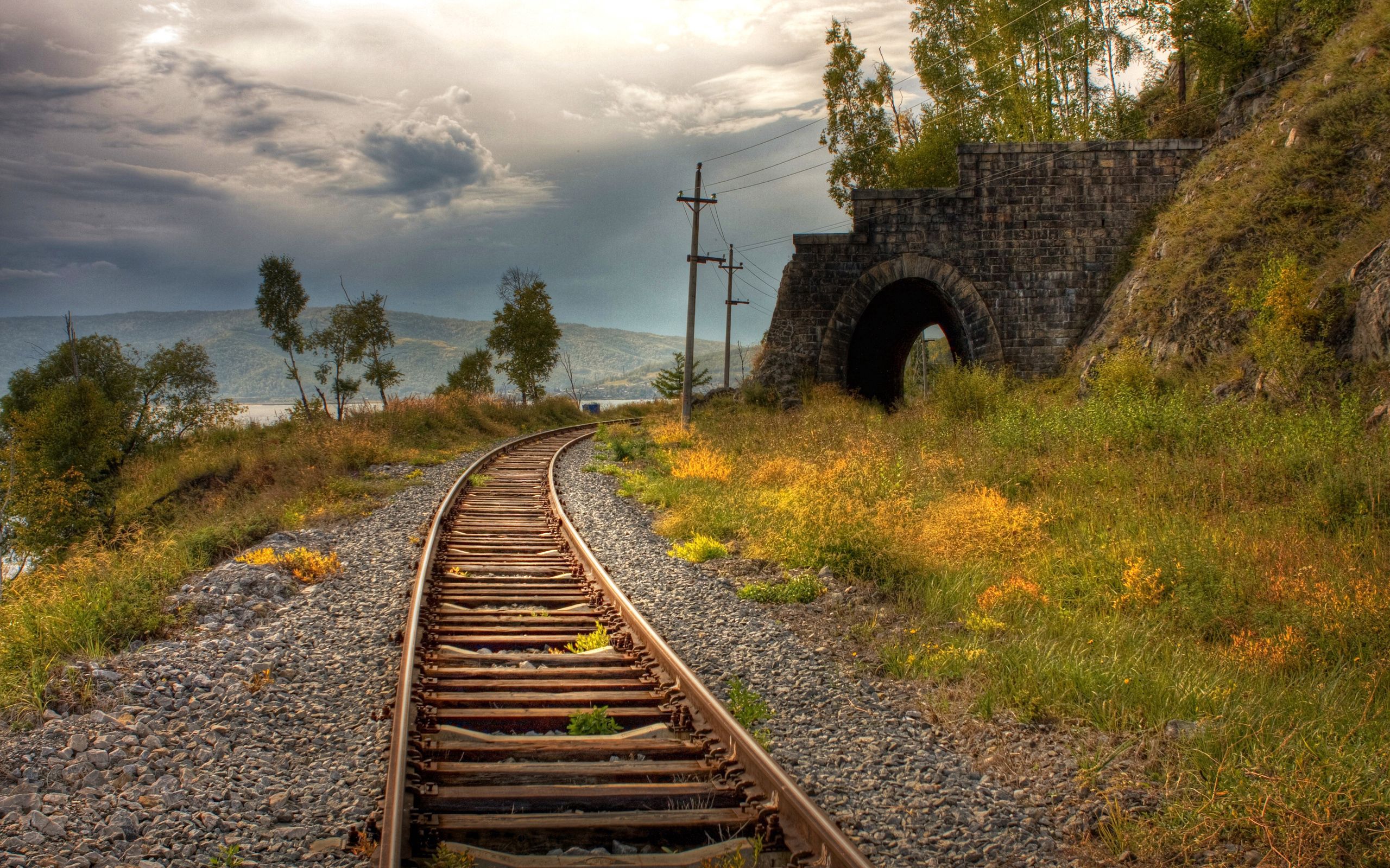 railway, rails, nature, grass, pebble, arch, pillars, posts Free Stock Photo